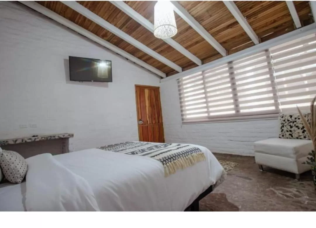 Bed in Rústic Hotel Quinta La Aurora