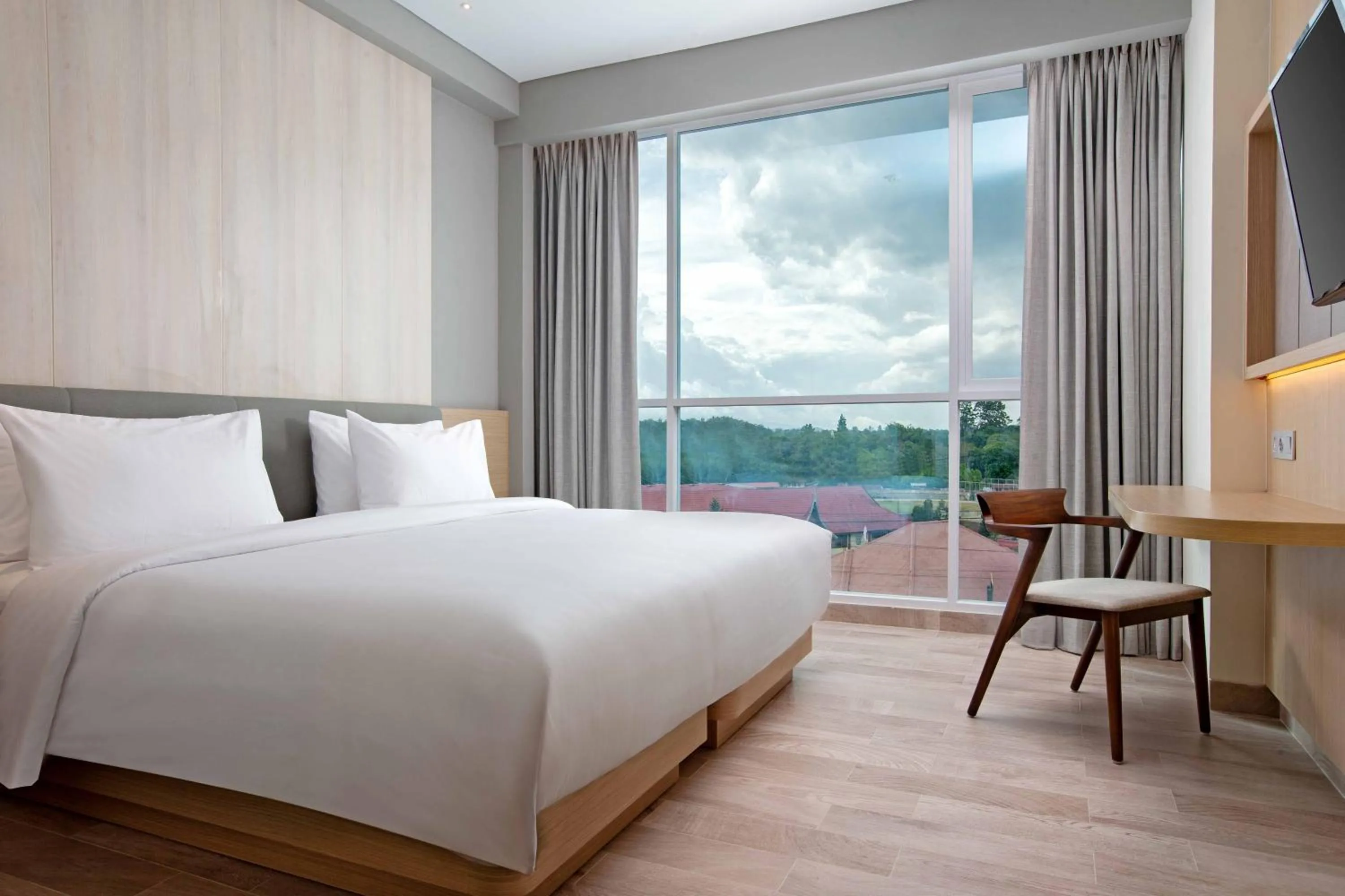 Photo of the whole room, Bed in Hotel Santika Bukittinggi