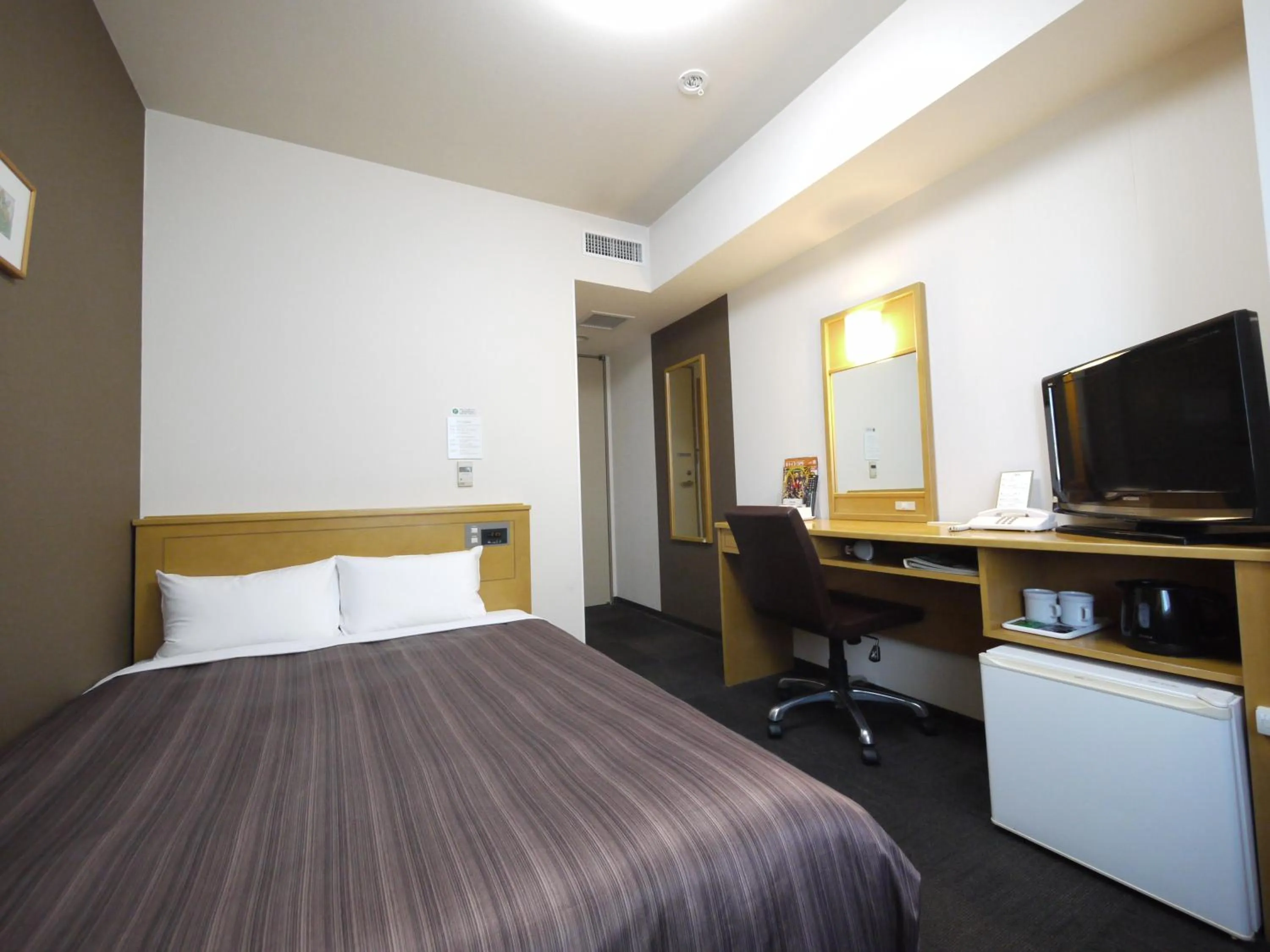 Photo of the whole room, Bed in Hotel Route-Inn Obihiro Ekimae