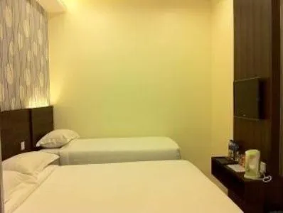 Bed in The Regency Garden Hotel