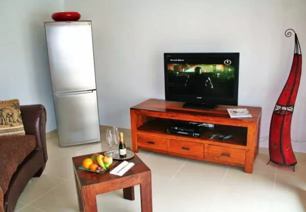 TV and multimedia, TV/Entertainment Center in Birdcage Gay Men Resort and Lifestyle Hotel