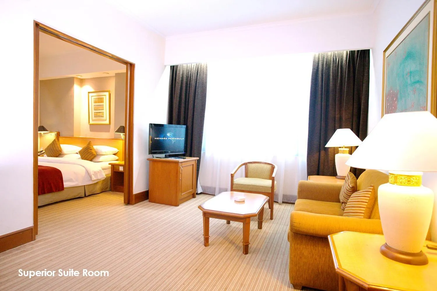 Living room, Bed in Menara Peninsula Hotel