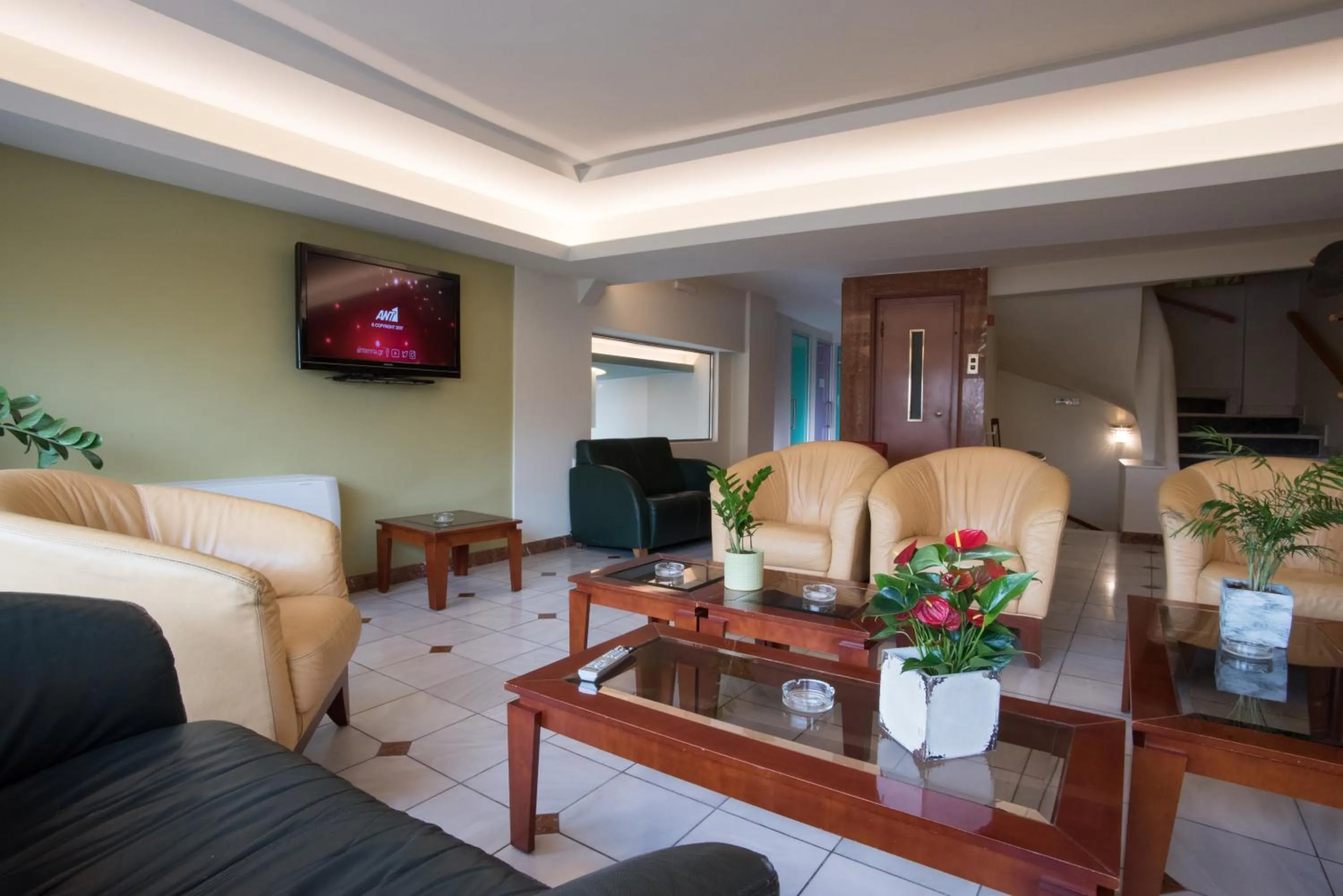 Communal lounge/ TV room in Morfeas Hotel