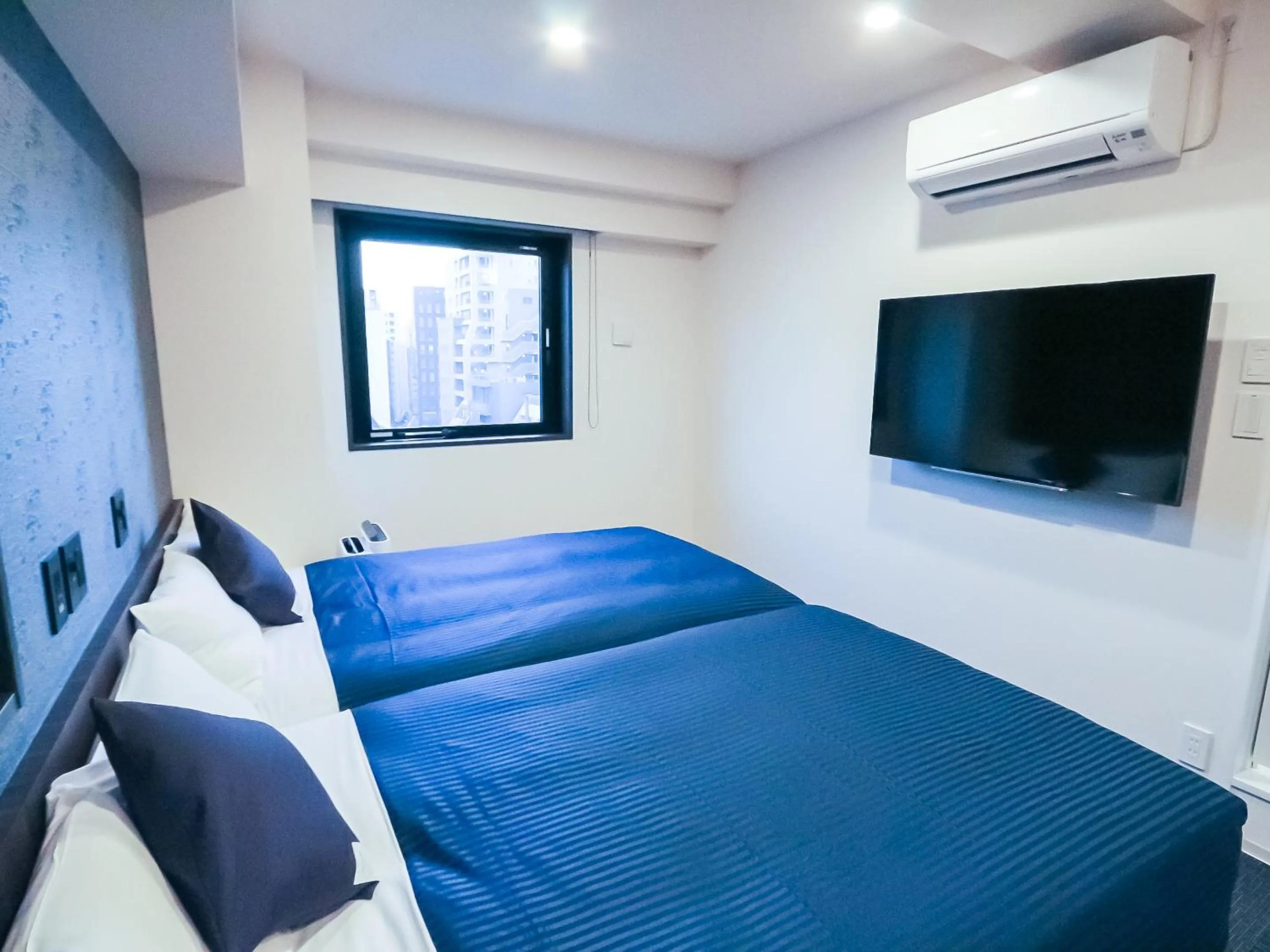 Bed in HOTEL LiVEMAX Tokyo Shintomicho