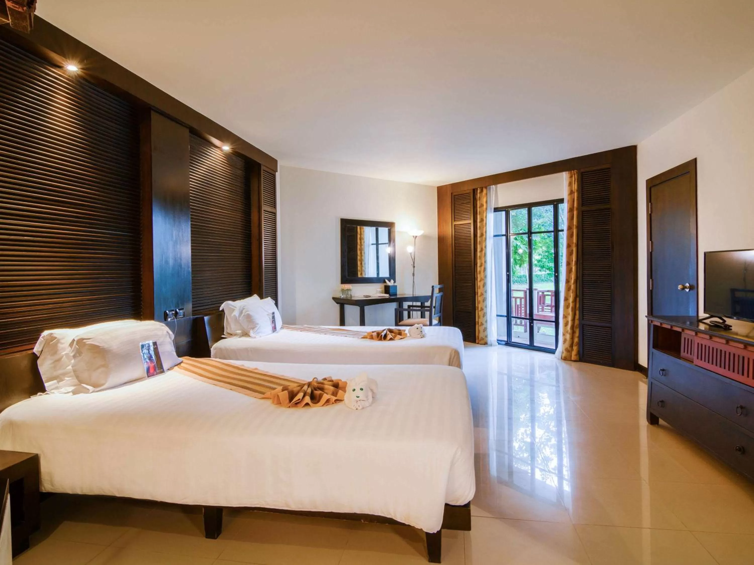 Photo of the whole room, Bed in The Nouveau Chumphon Beach Resort And Golf