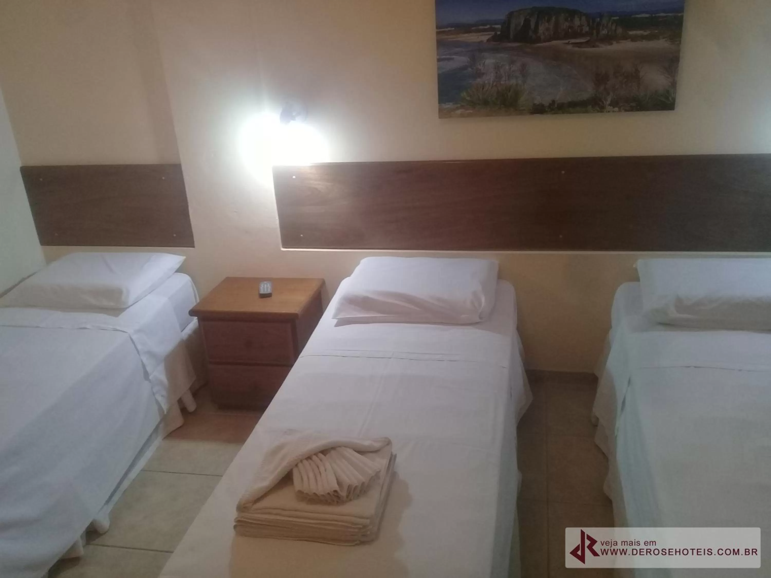 Bed in De Rose Palace Hotel