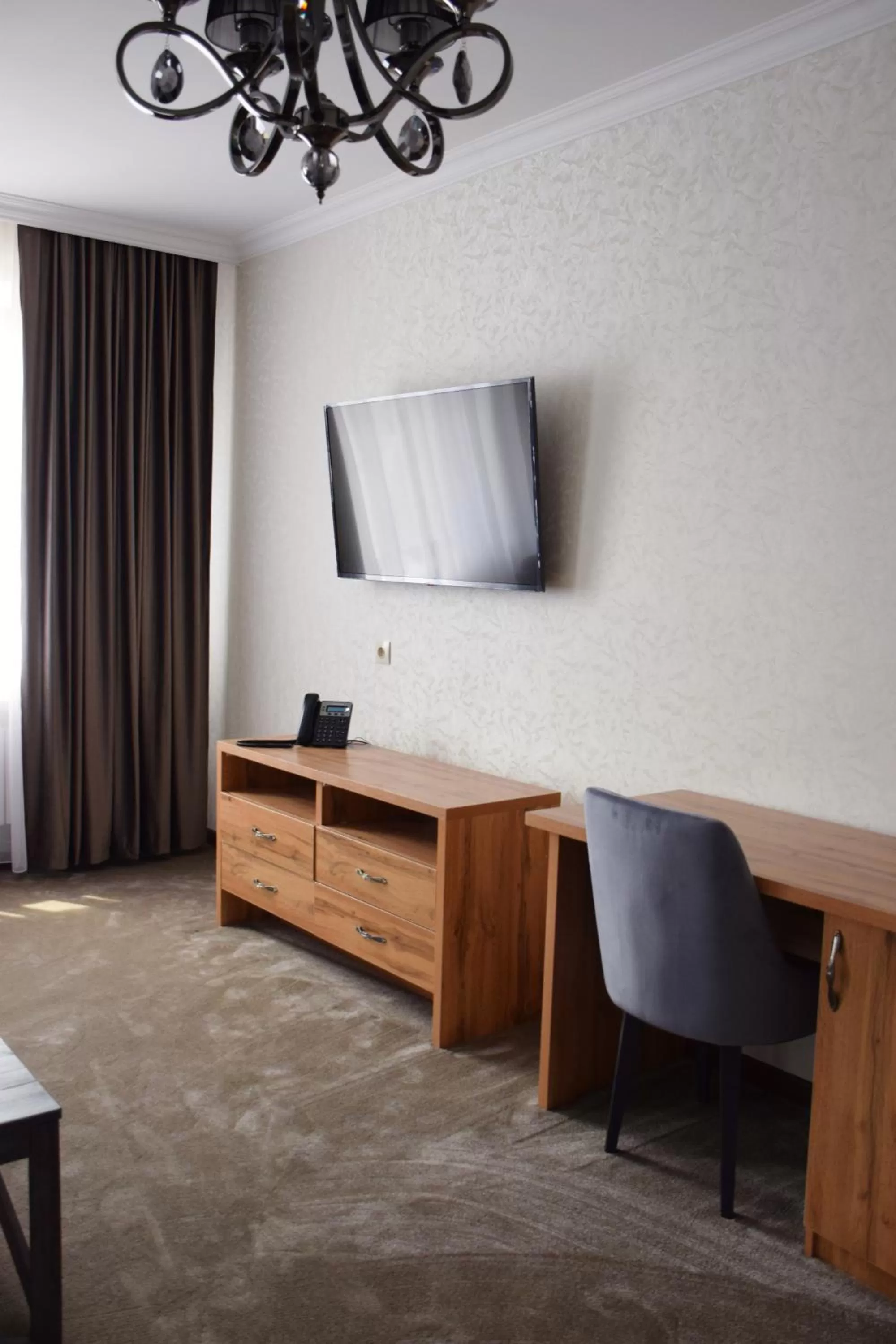 Seating area, TV/Entertainment Center in MirOtel Hotel