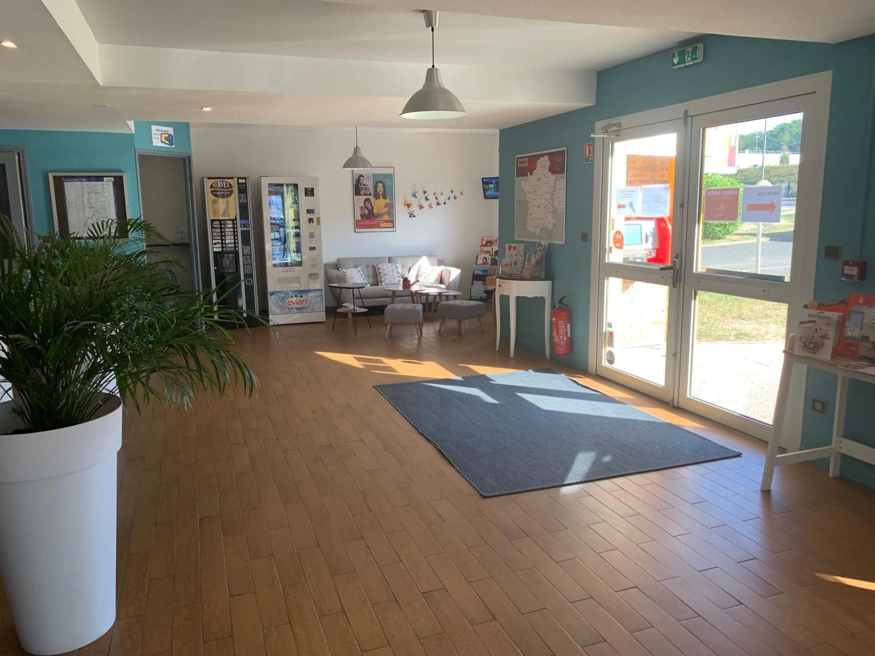 Lobby or reception in initial by balladins Tours Sud