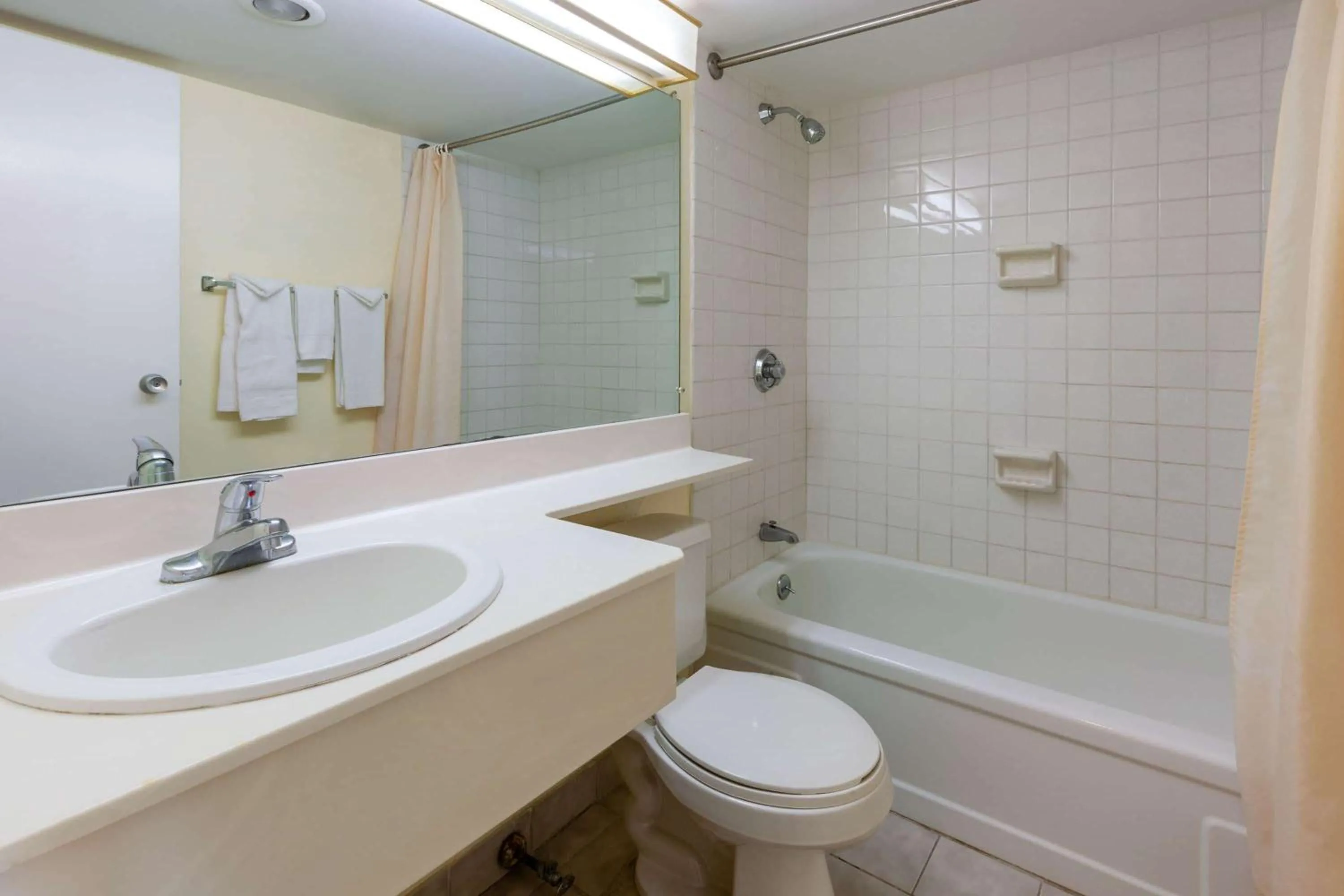 Bathroom in Travelodge by Wyndham Cleveland Airport