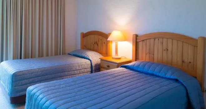 Bed in Andari Holiday Apartments