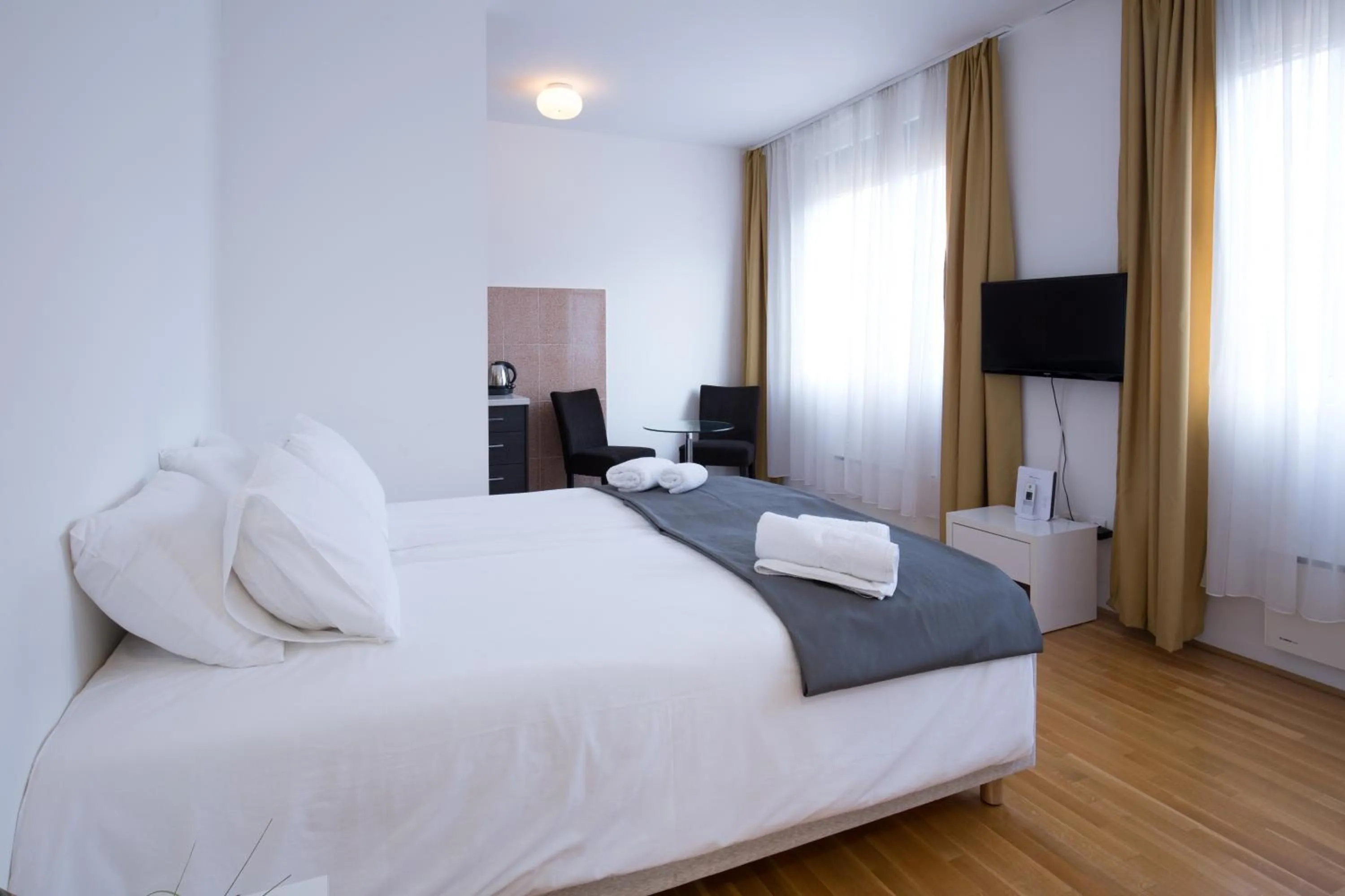 TV and multimedia, Bed in Nova City Garni Hotel Signature Collection