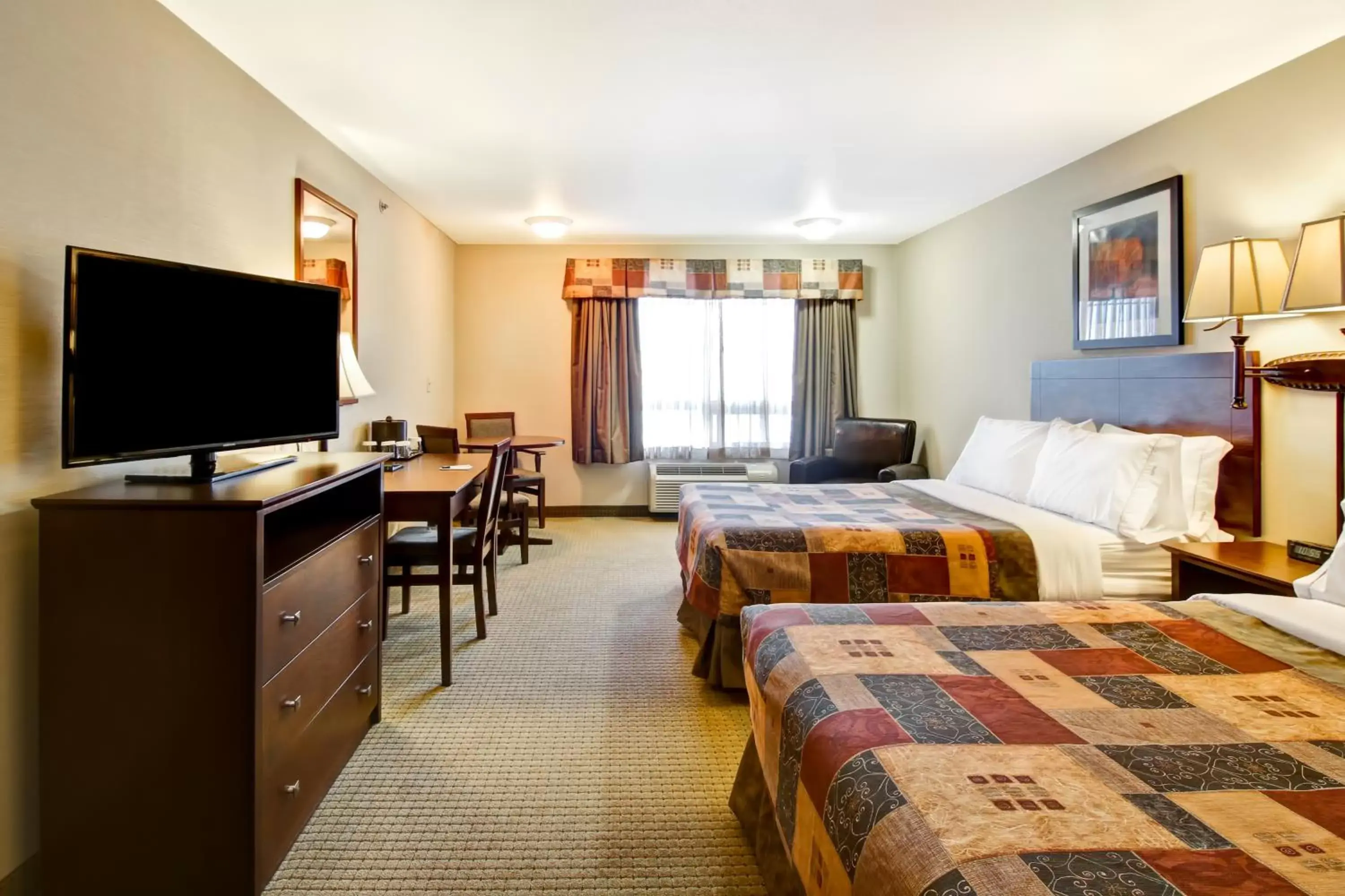 Queen Room with Two Queen Beds and Sofa Bed in Canalta Camrose Queen Room with Two Queen Beds and Sofa Bed in Canalta Camrose