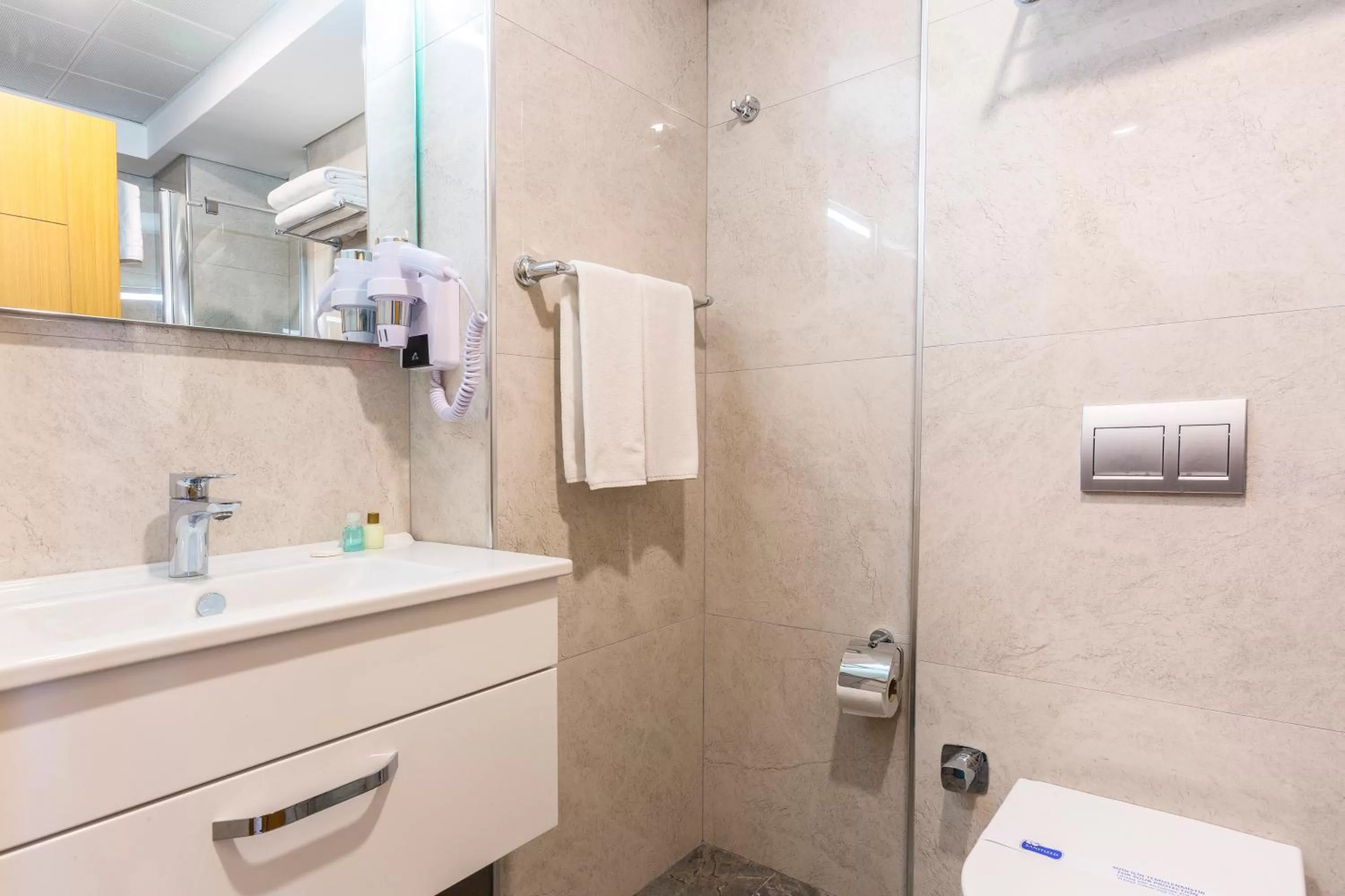 Bathroom in Obelisk Hotel & Suites