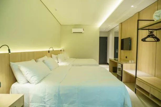 Bed in Rafain Palace Hotel & Convention Center