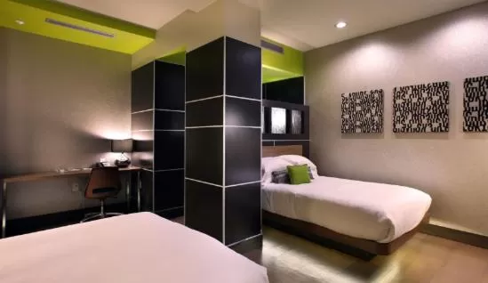 Photo of the whole room, Bed in CityFlatsHotel - Grand Rapids, an Ascend Collection Hotel