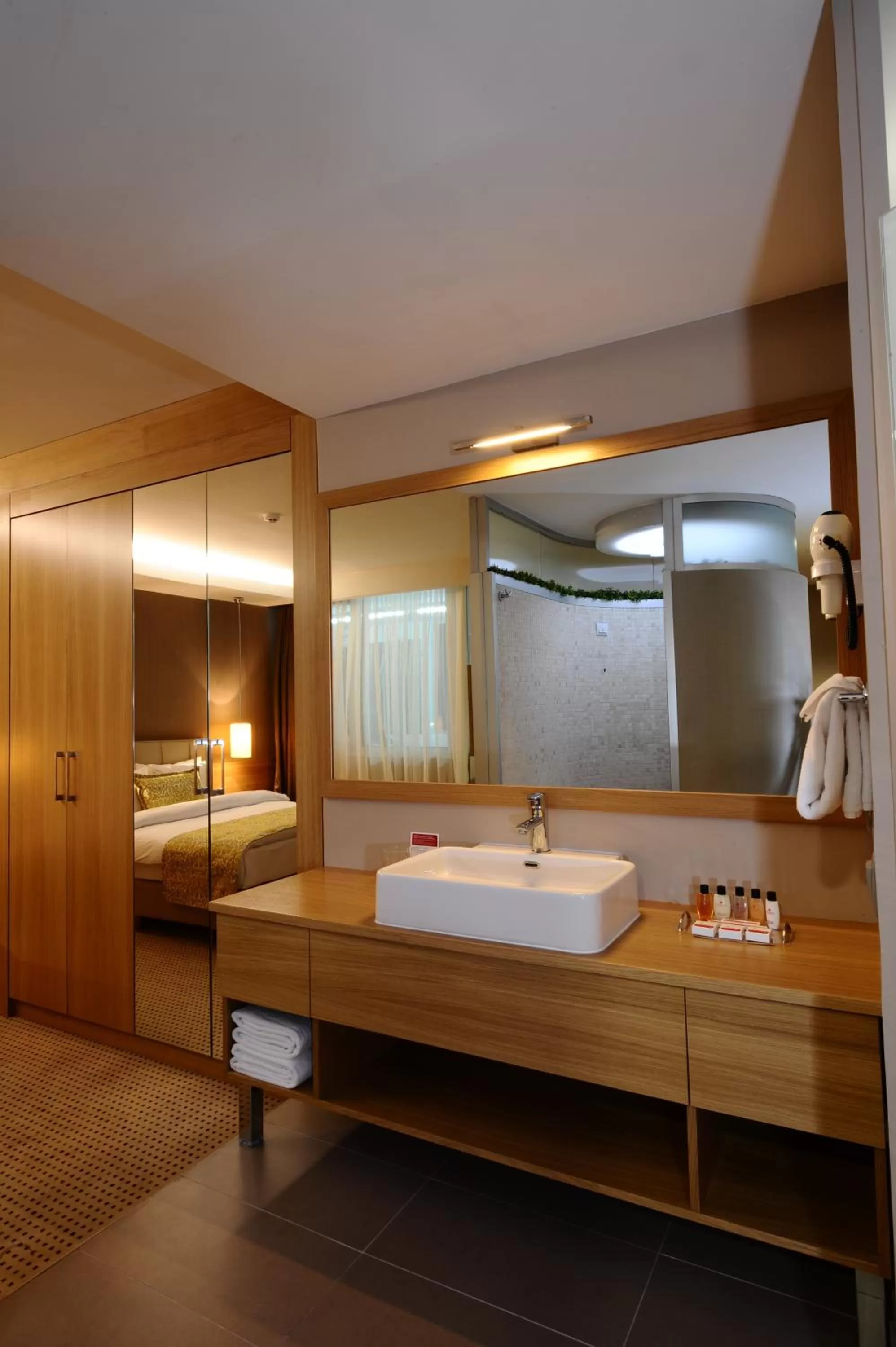 Bathroom, Bed in Ramada by Wyndham Podgorica