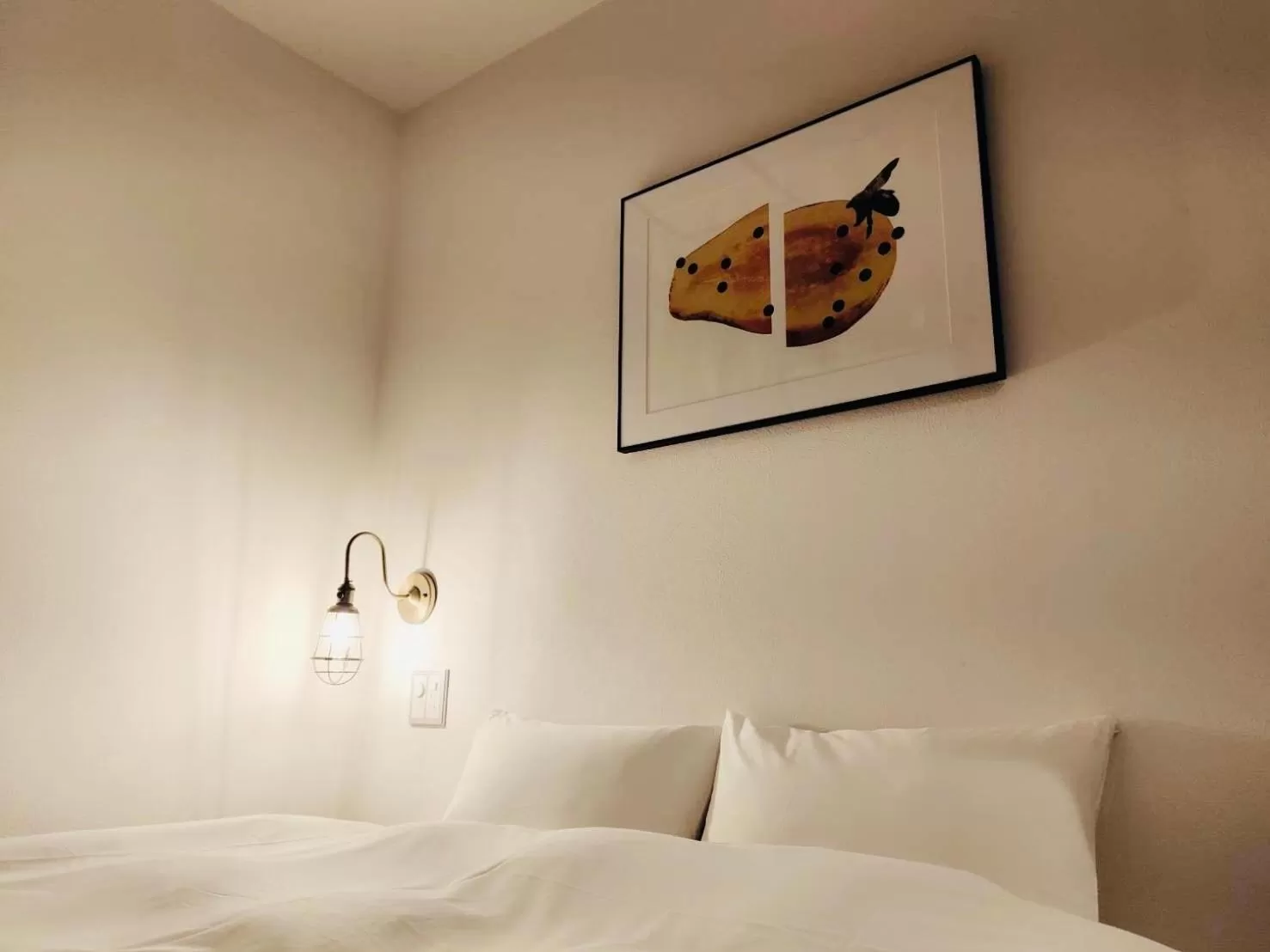 Bed in BENJAMIN HOTEL KANAZAWA