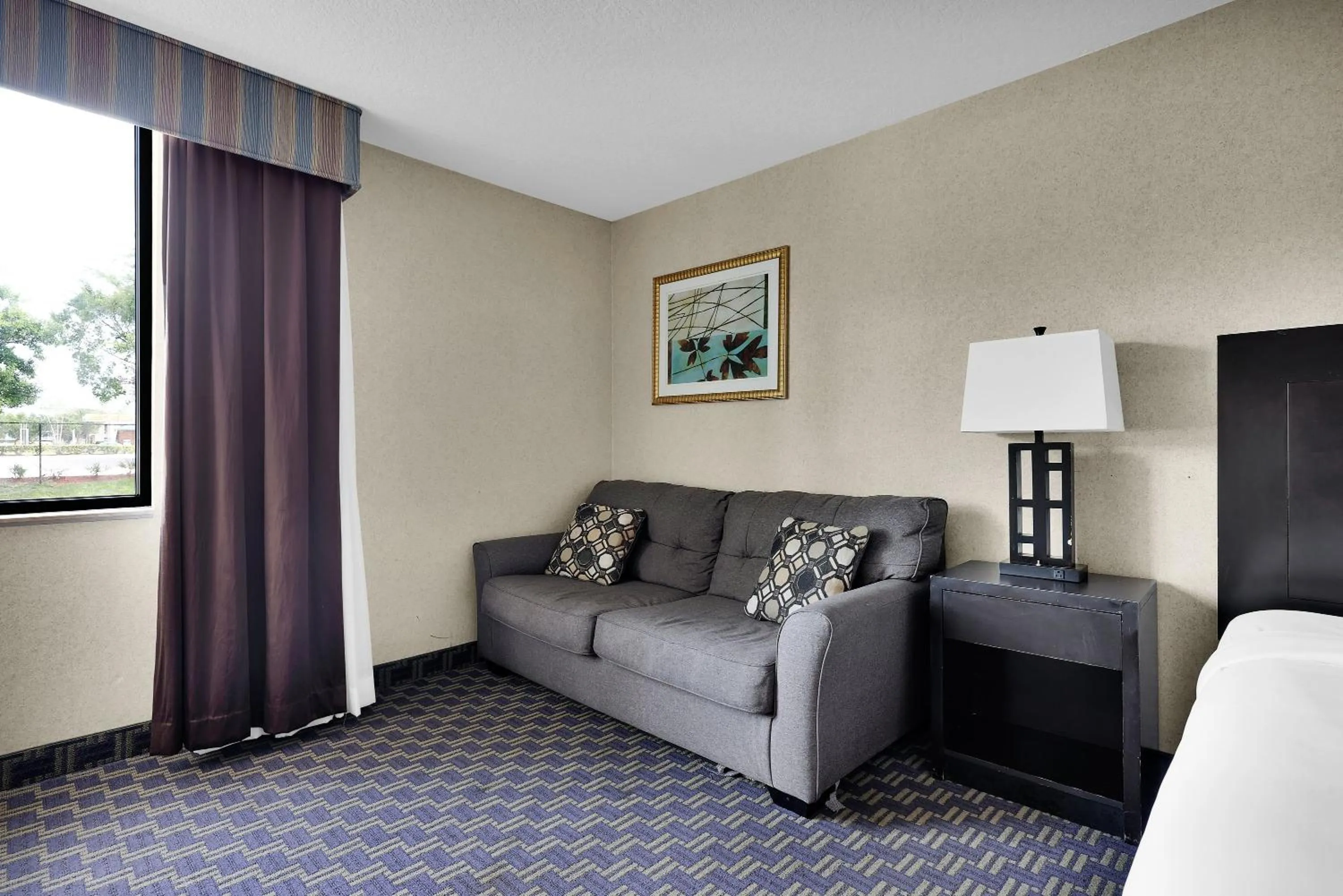 Seating area in Ramada by Wyndham Jacksonville I-95 by Butler Blvd