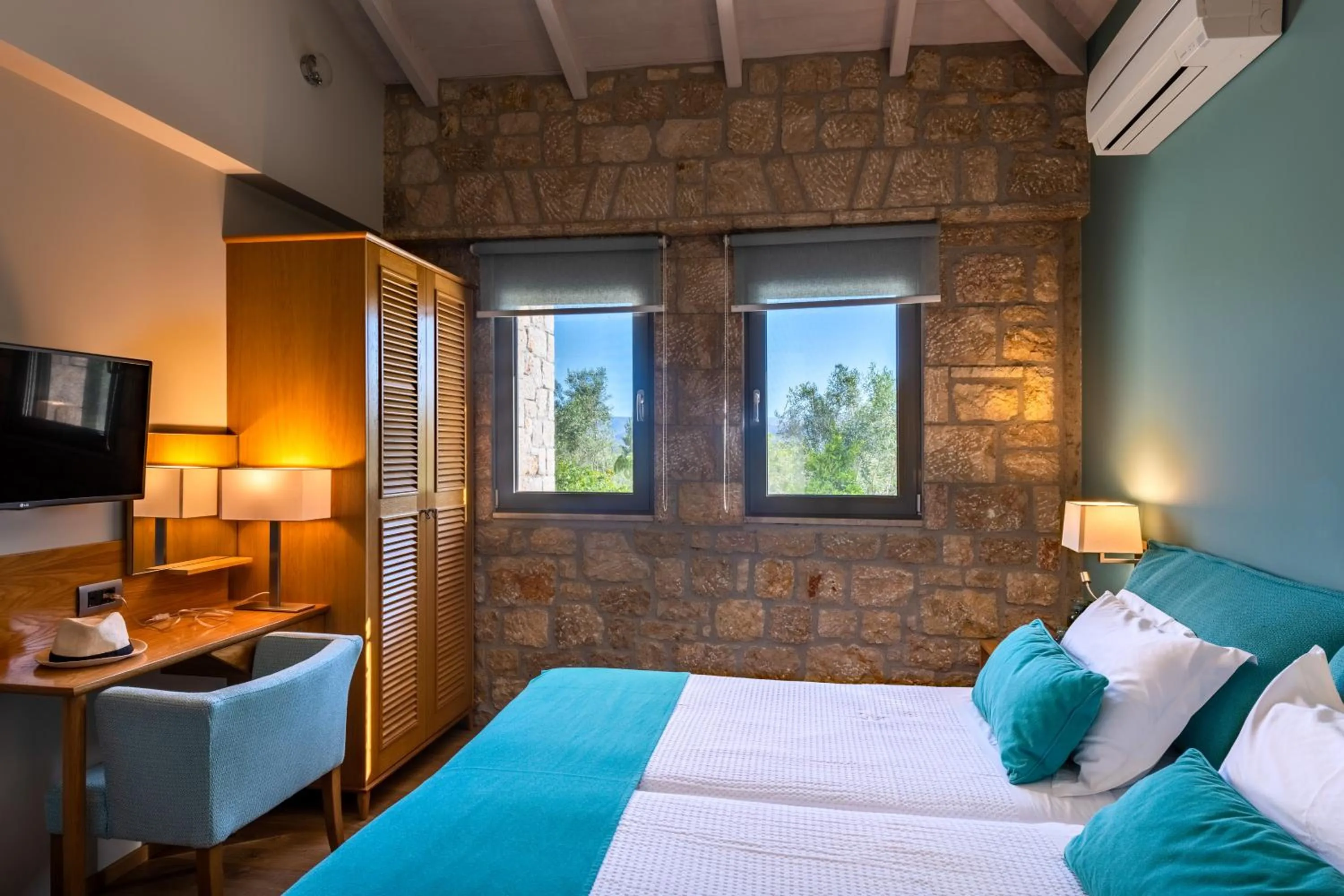 Bed in Anthemion Suites and Villas