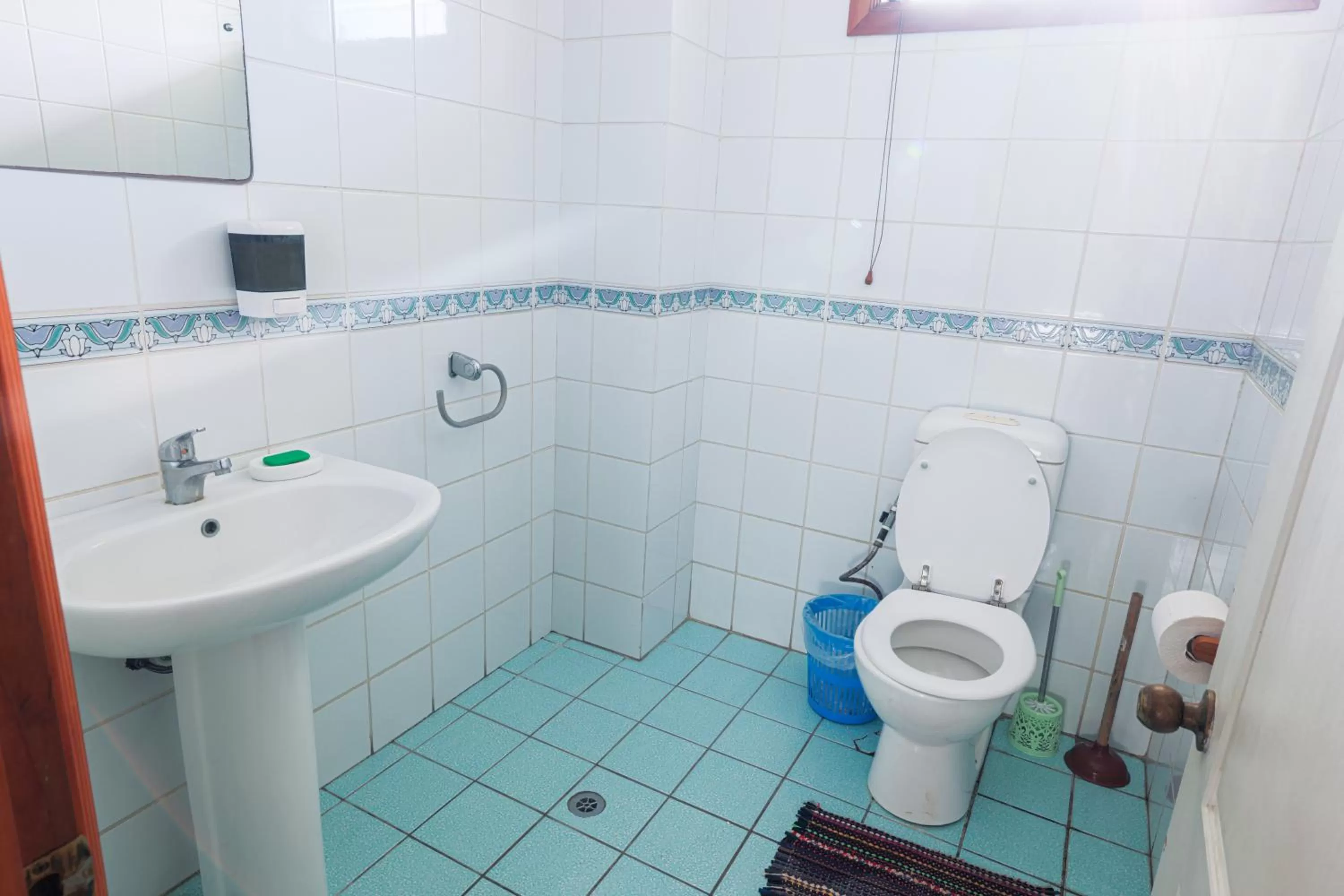 Toilet, Bathroom in Lynn's Getaway Hotel