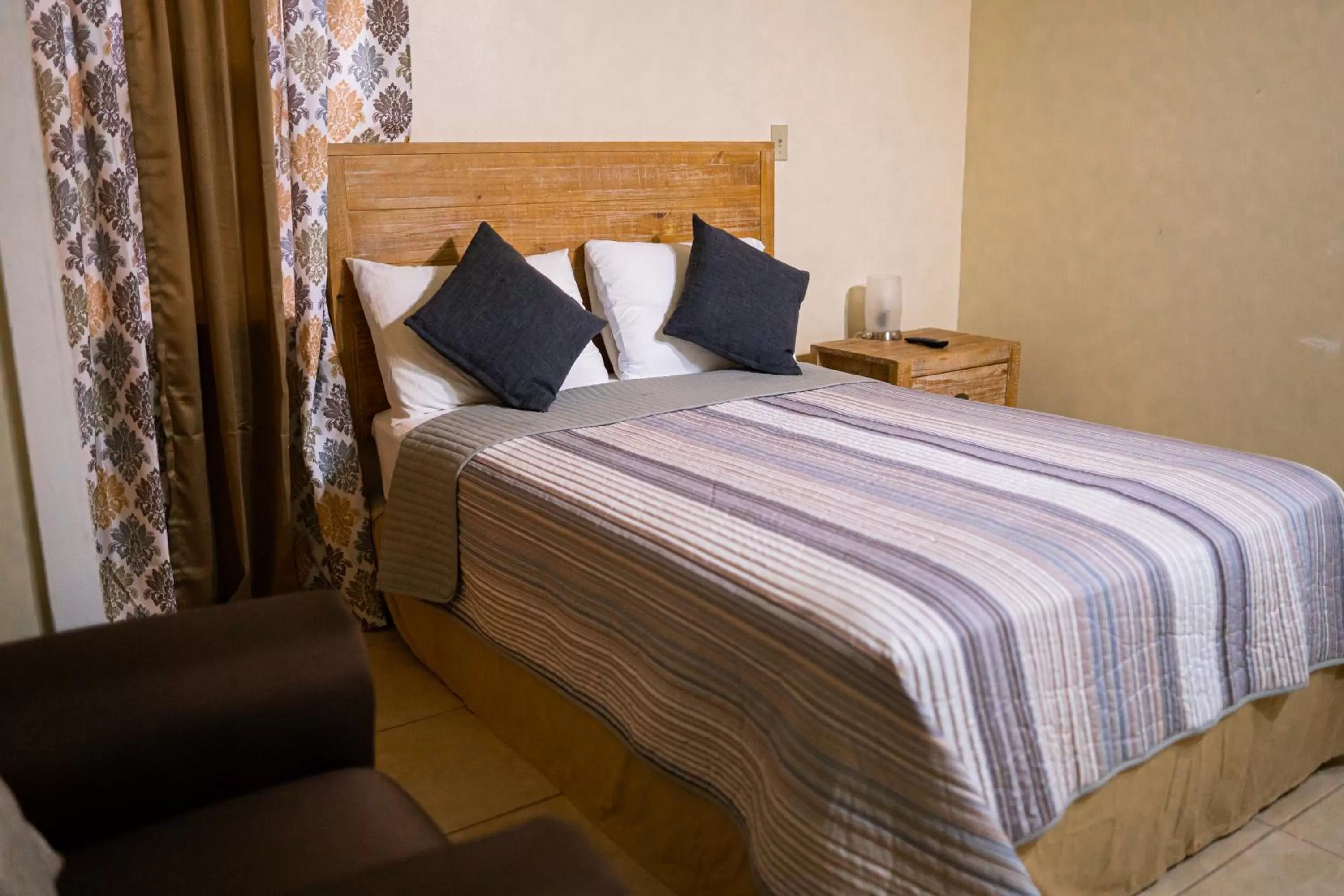 Bed in Connie's Comfort Suites