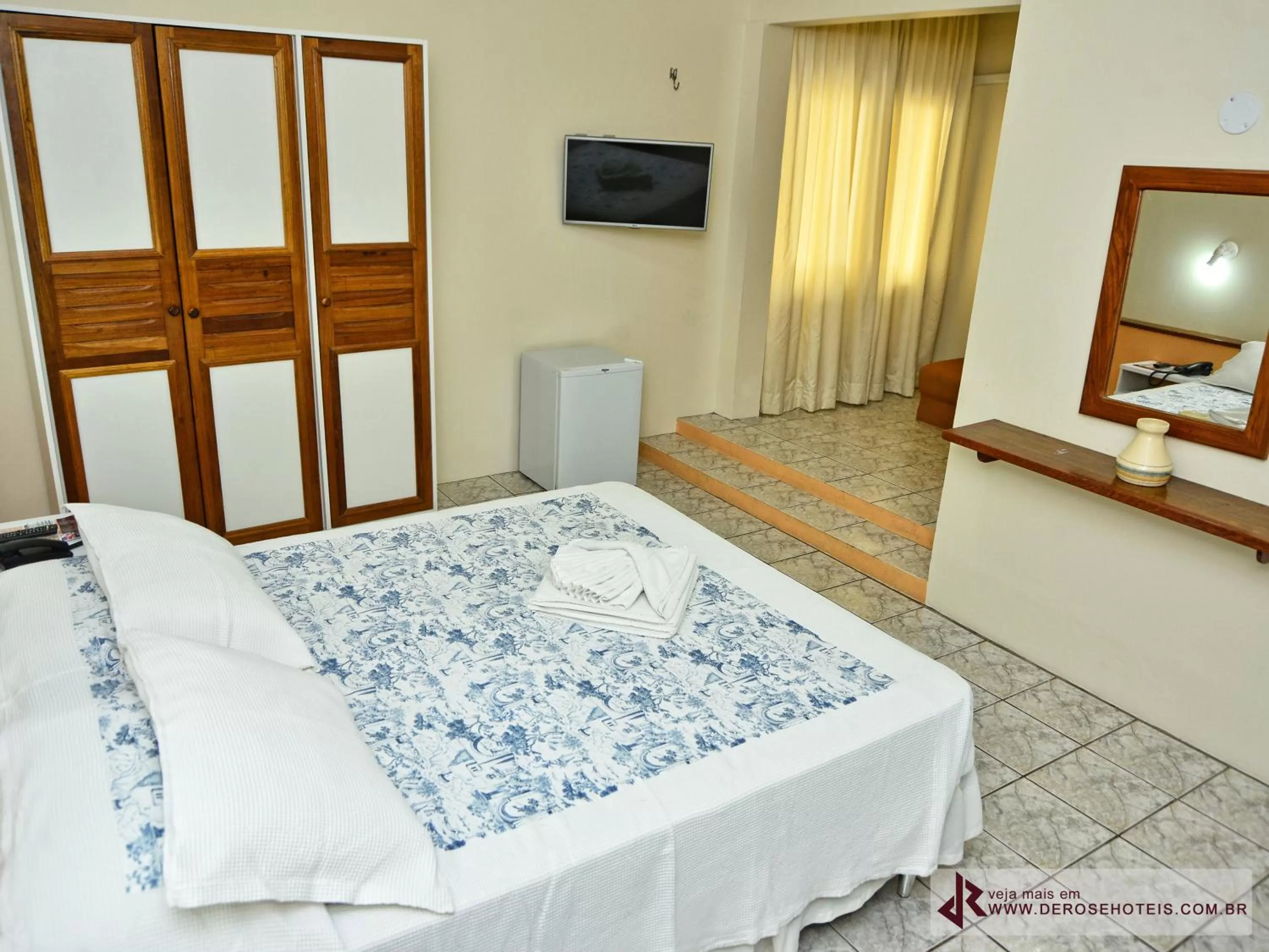 Bed in De Rose Palace Hotel