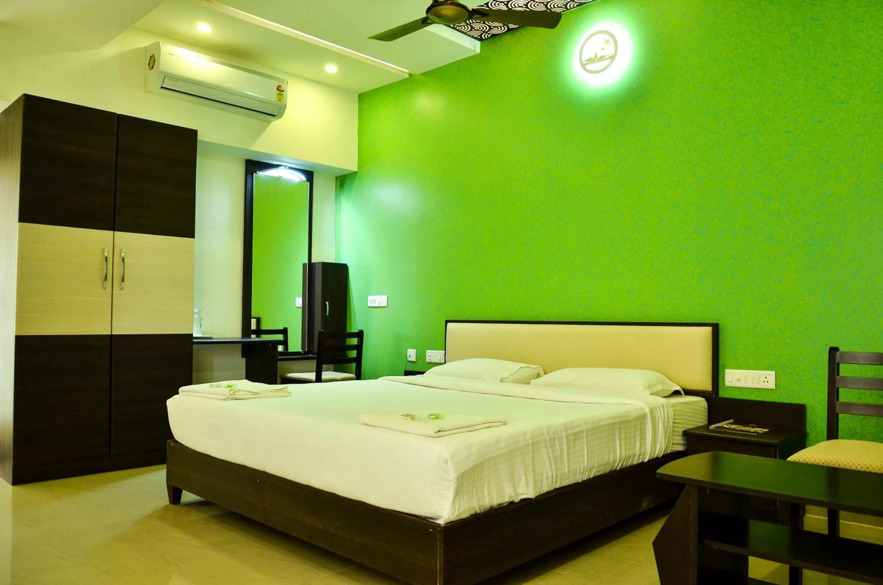 Bed in Hotel Ambai Grand