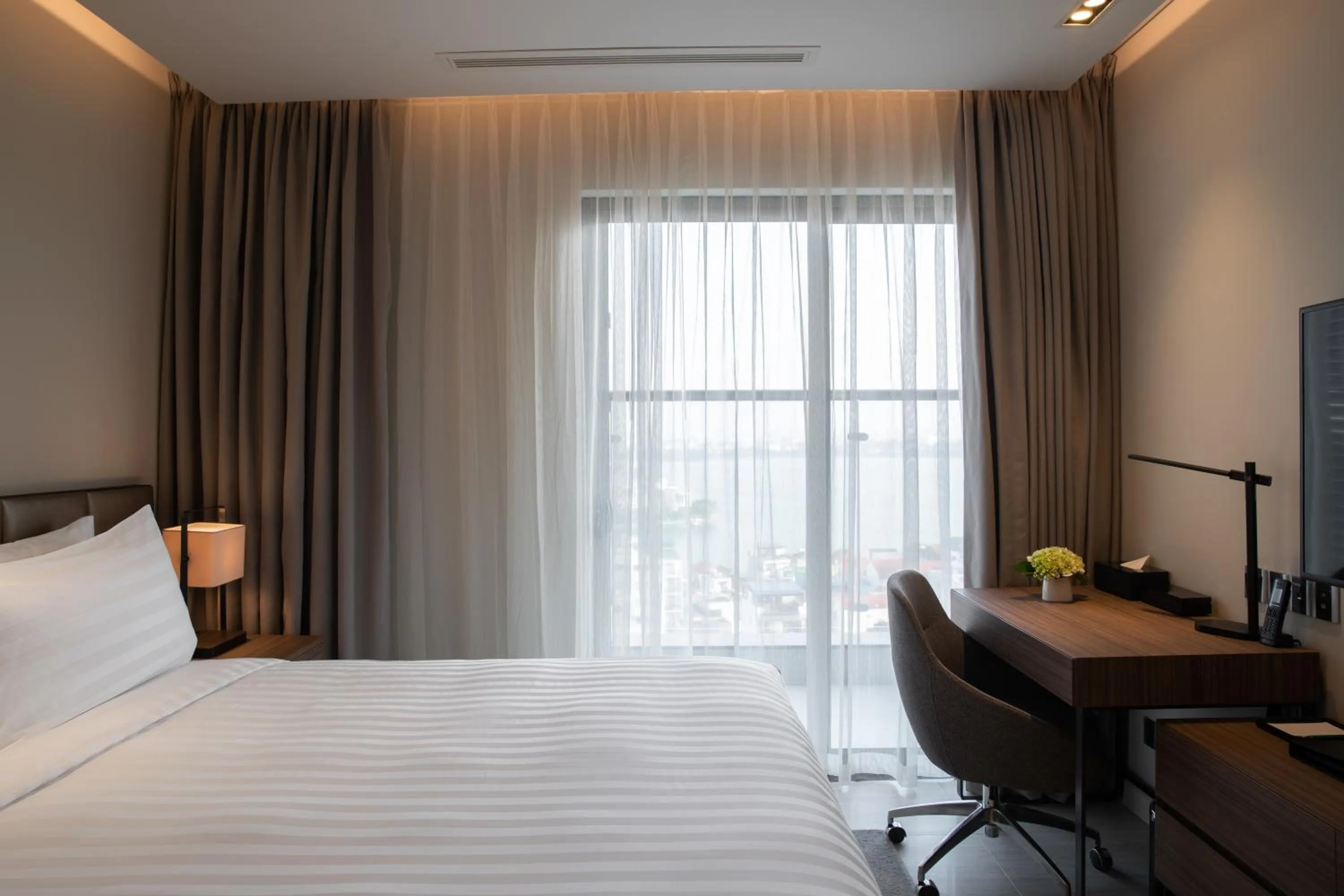 Bed in Oakwood Residence Hanoi