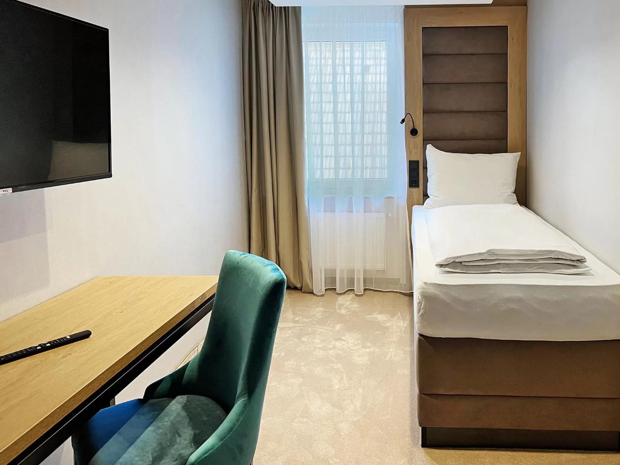 Photo of the whole room, Bed in DORMERO Hotel Reutlingen