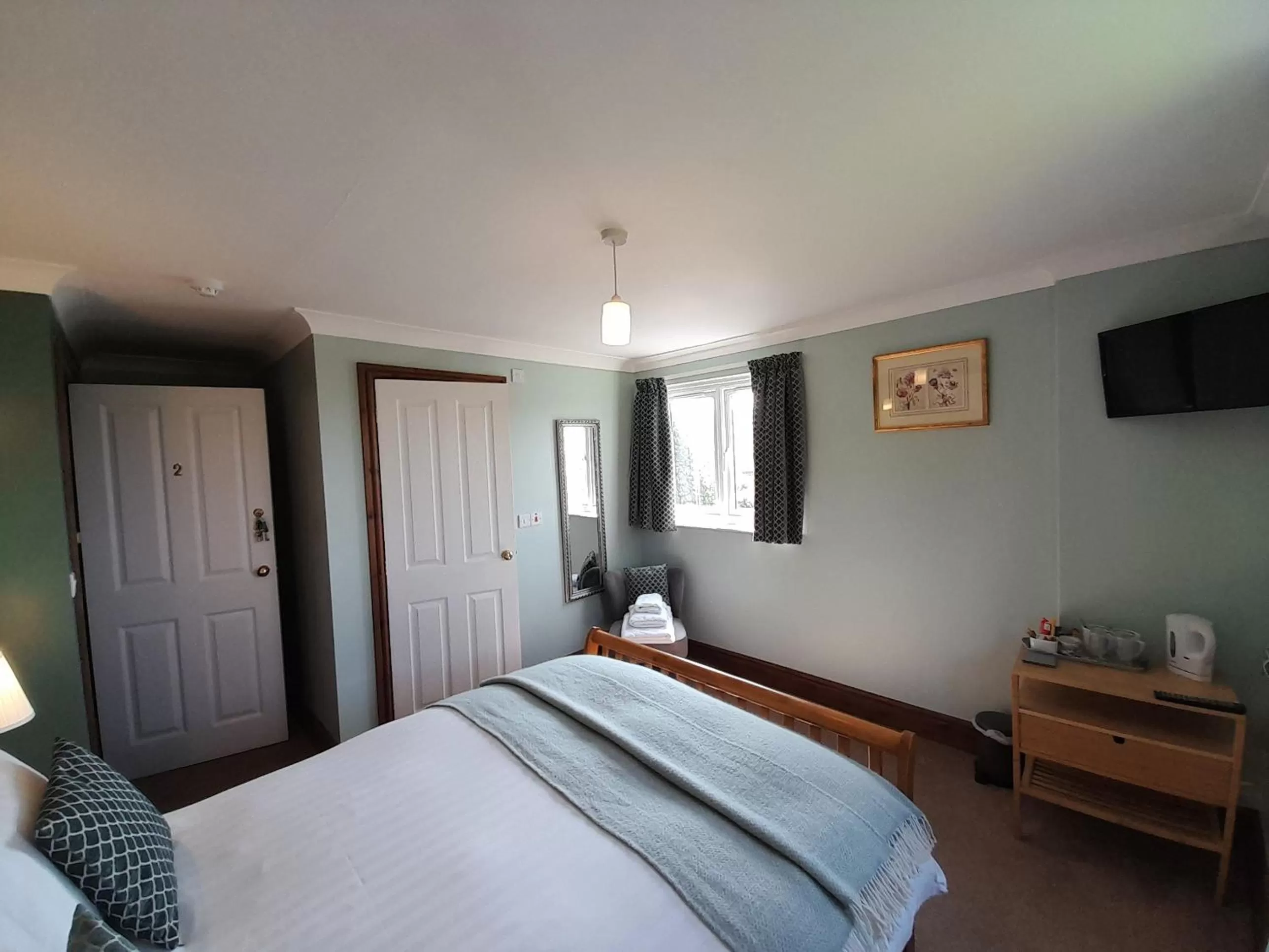 Bed in The Dolfor Inn