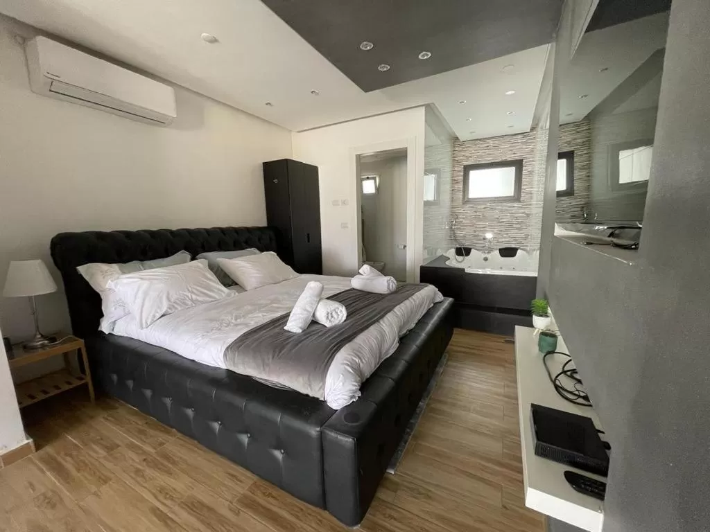 Bed in Lev Eilat Suites