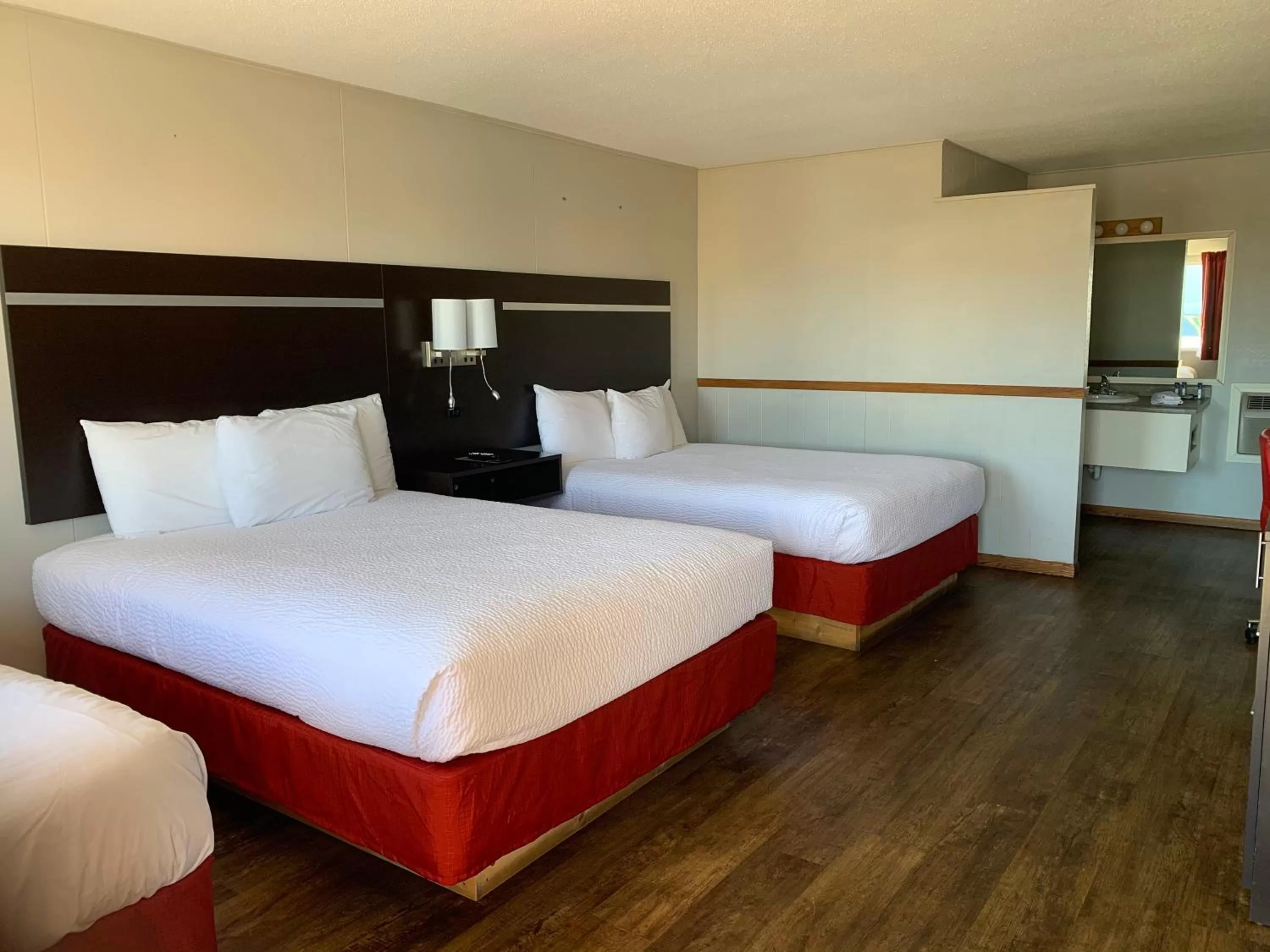 2 Queen Beds 1 Twin Bed Non-Smoking in Americas Best Value Inn Wall