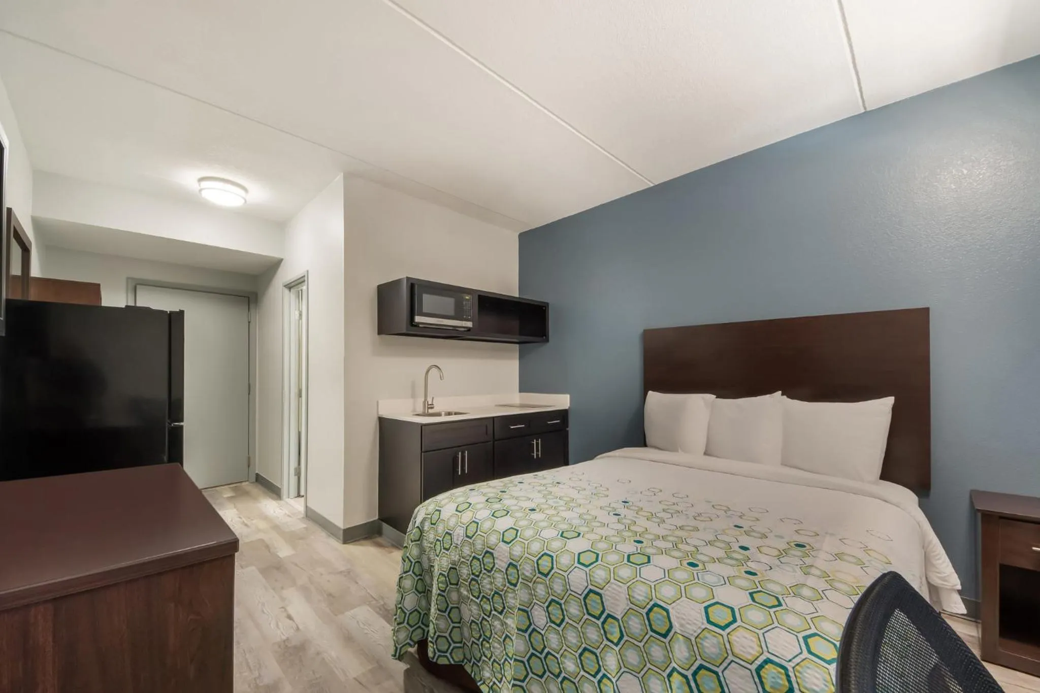 Bedroom, Bed in HomeTowne Studios by Red Roof San Antonio - SeaWorld Northwest