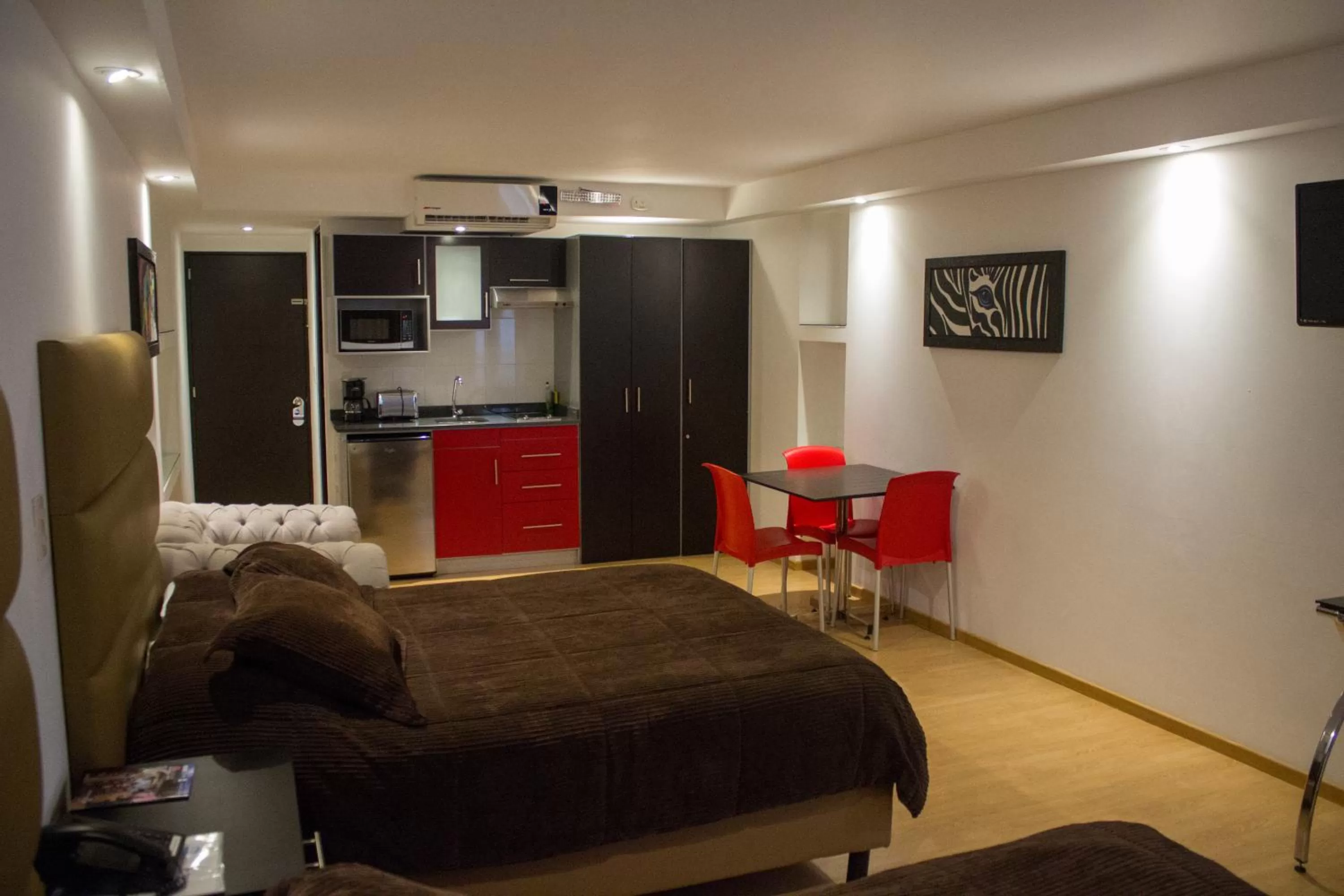 Photo of the whole room, Bed in My Home Suites