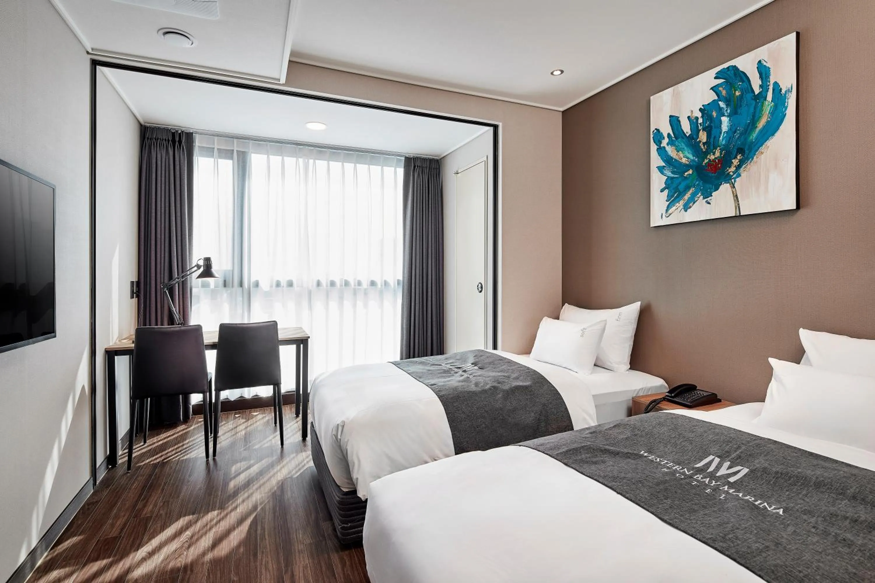 Bed in Western Bay Marina Hotel