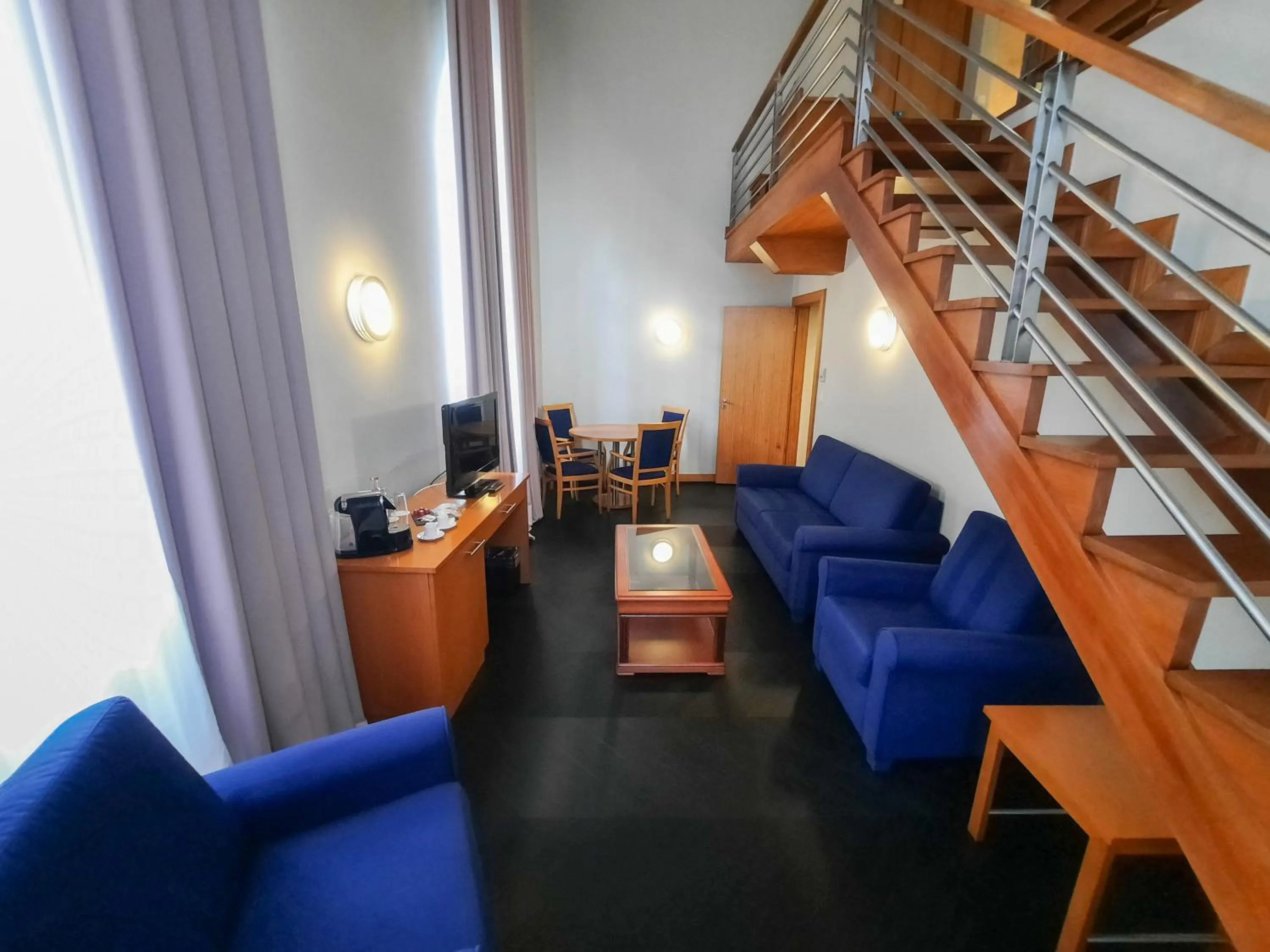 Living room in Azoris Angra Garden – Plaza Hotel