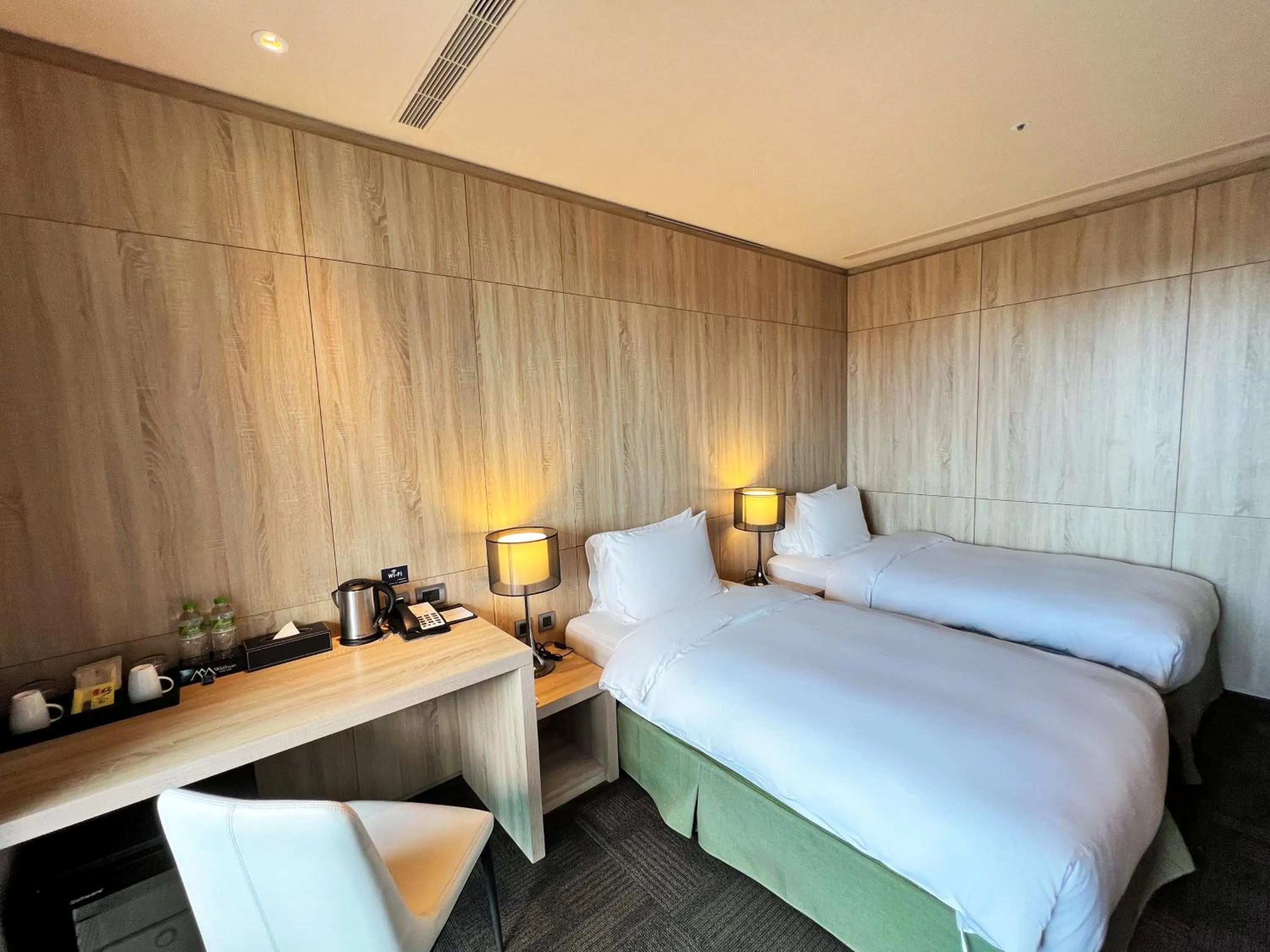 Bed in Wallsun Hotel