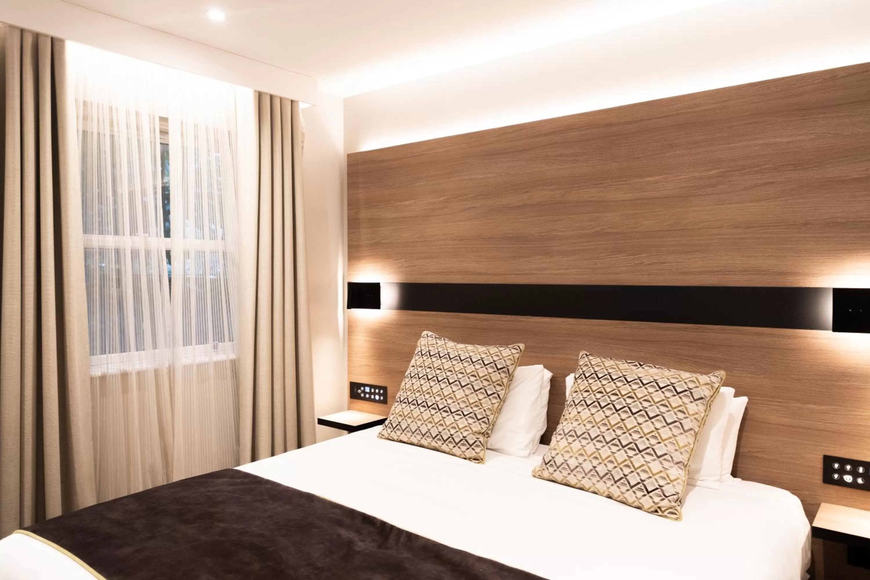 Bed in Merit Kensington Hotel