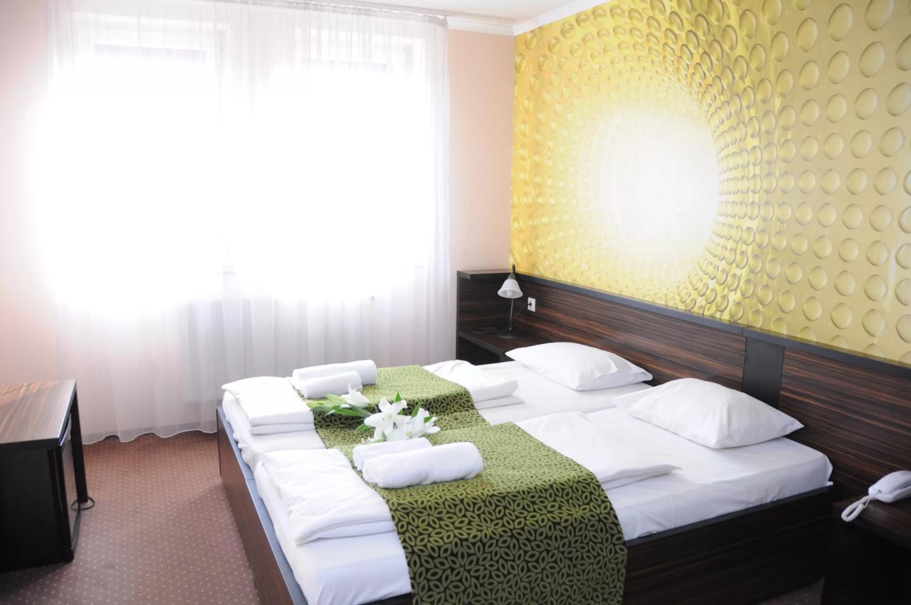 Bed in Green Hotel Budapest