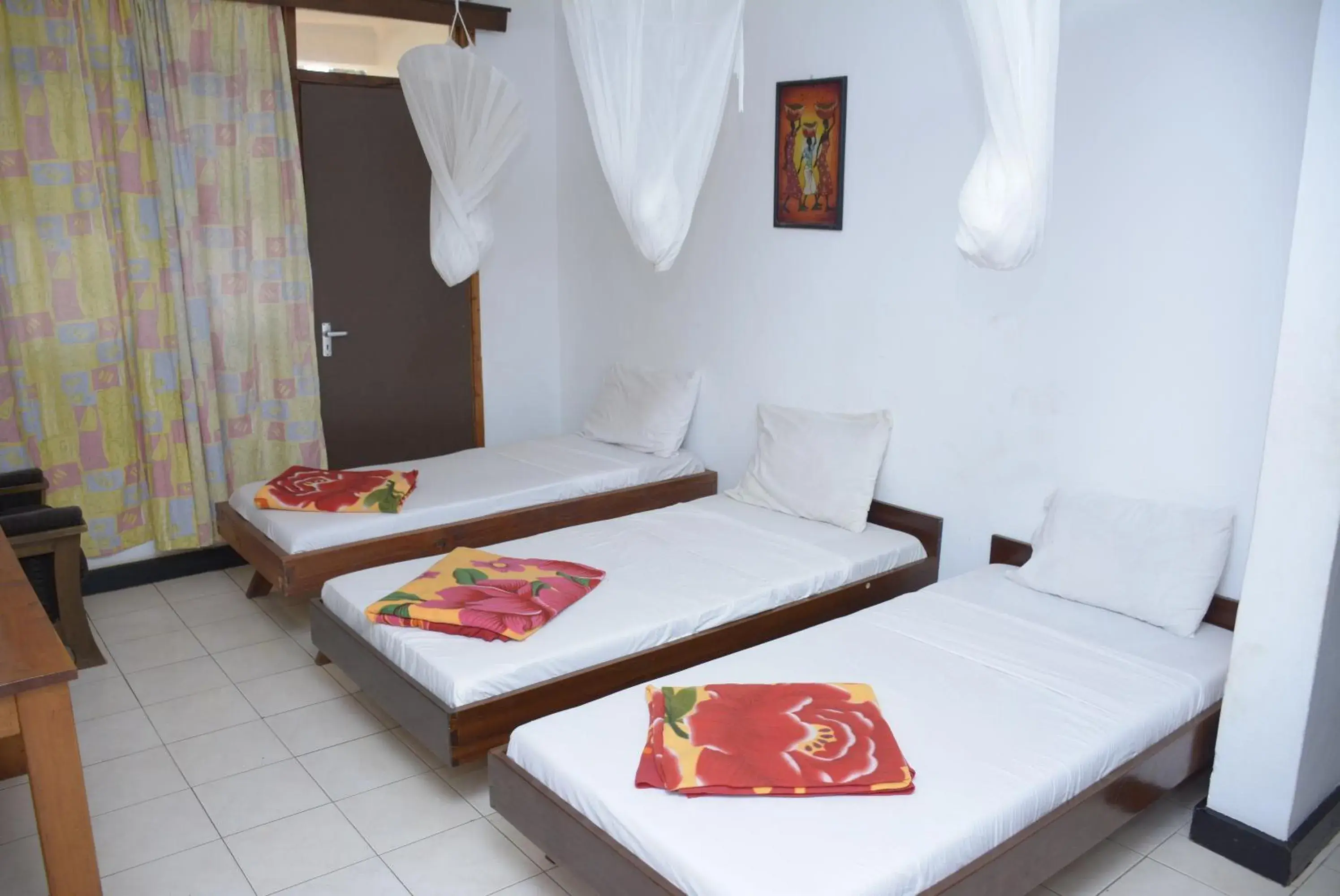 Standard Triple Room in Keys Hotel Mbokomu Branch Standard Triple Room in Keys Hotel Mbokomu Branch