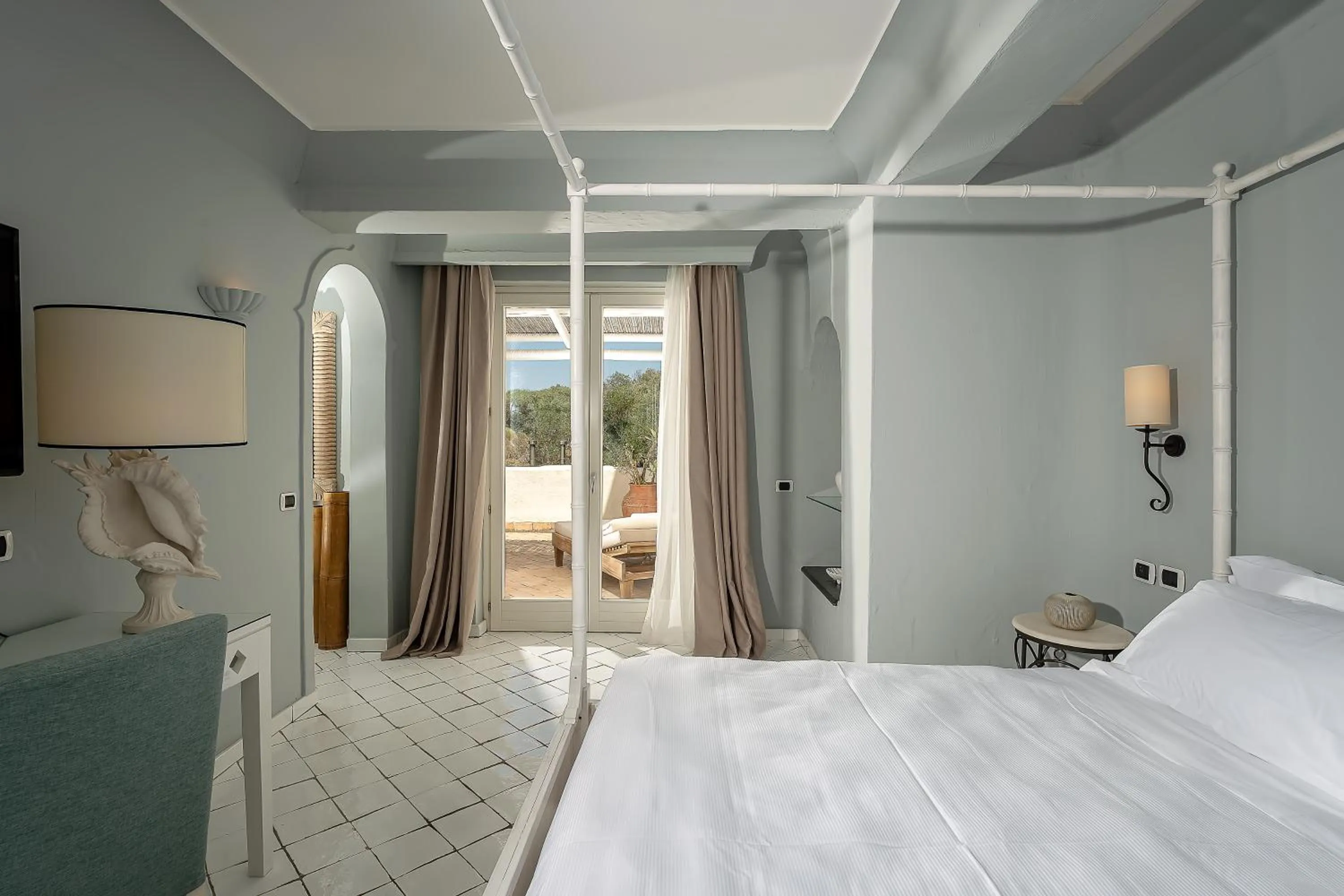 Bed in Therasia Resort Sea and SPA - The Leading Hotels of the World