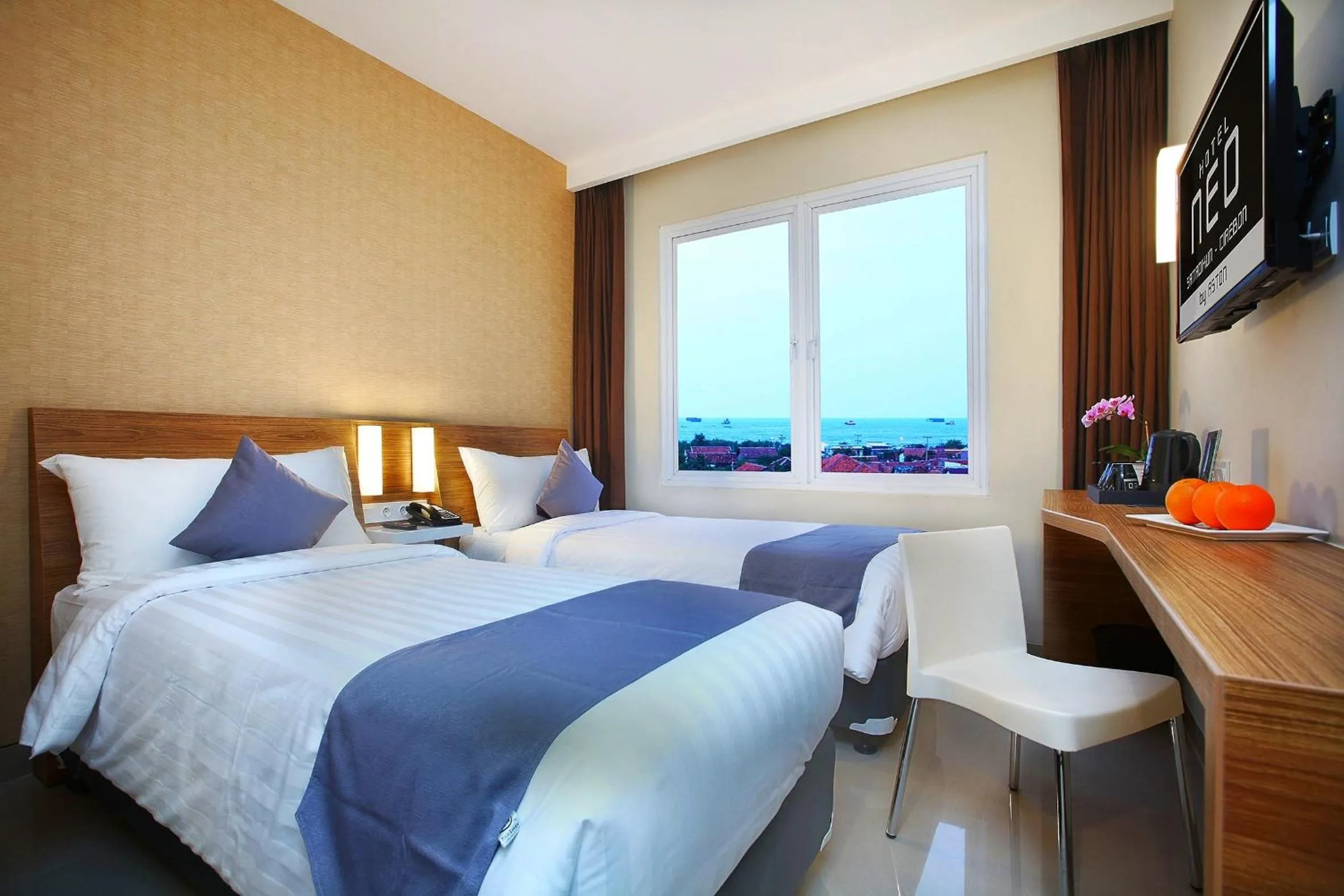 Photo of the whole room, Bed in Hotel NEO Cirebon by ASTON