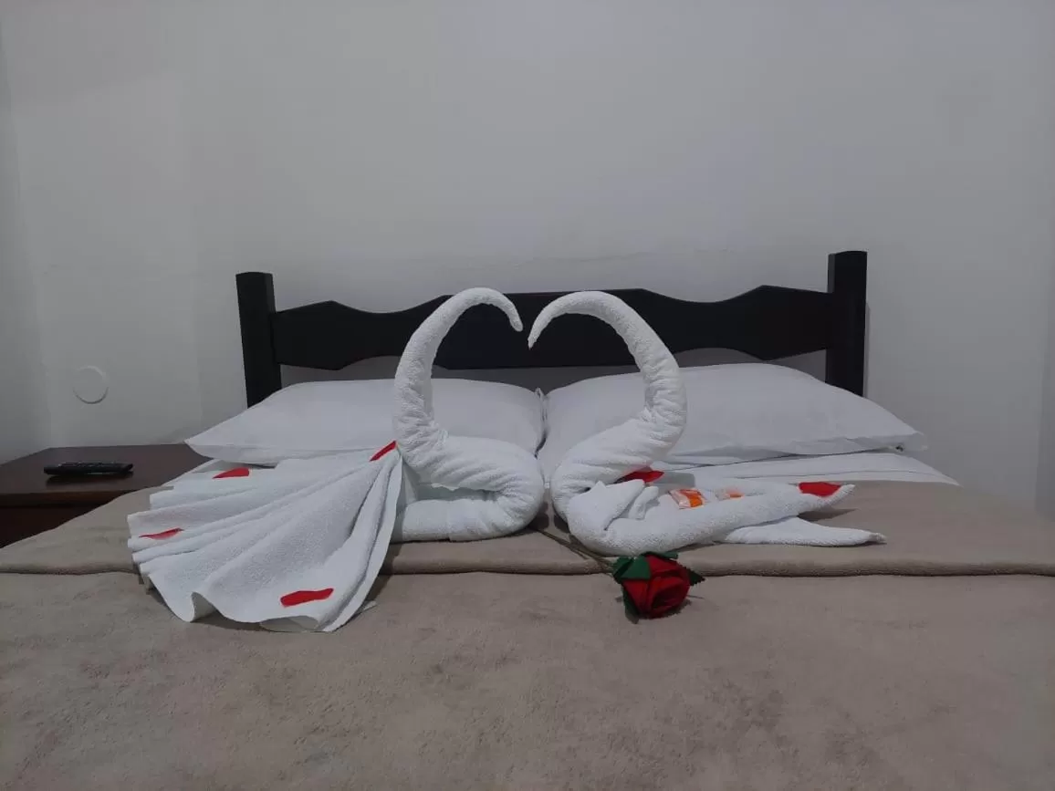 Bed in Pousada Xodó da Praia