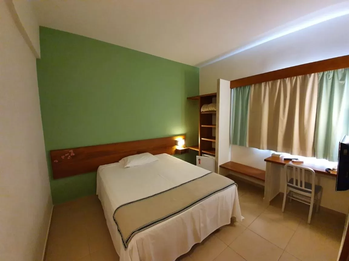 Bed in Meu Hotel Garça