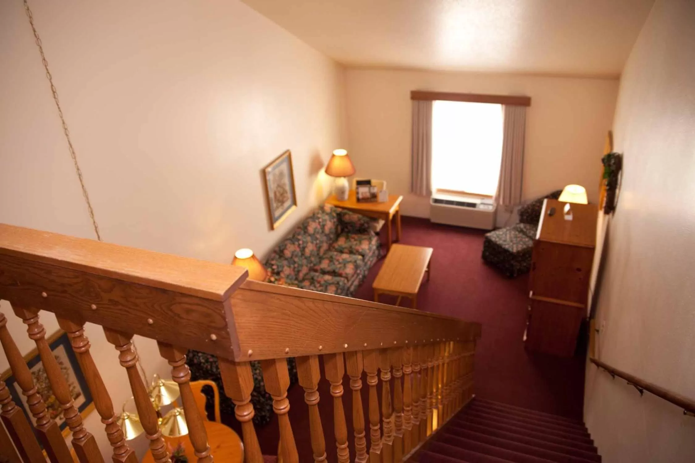 Seating area, Bed in Baymont by Wyndham Mequon Milwaukee Area