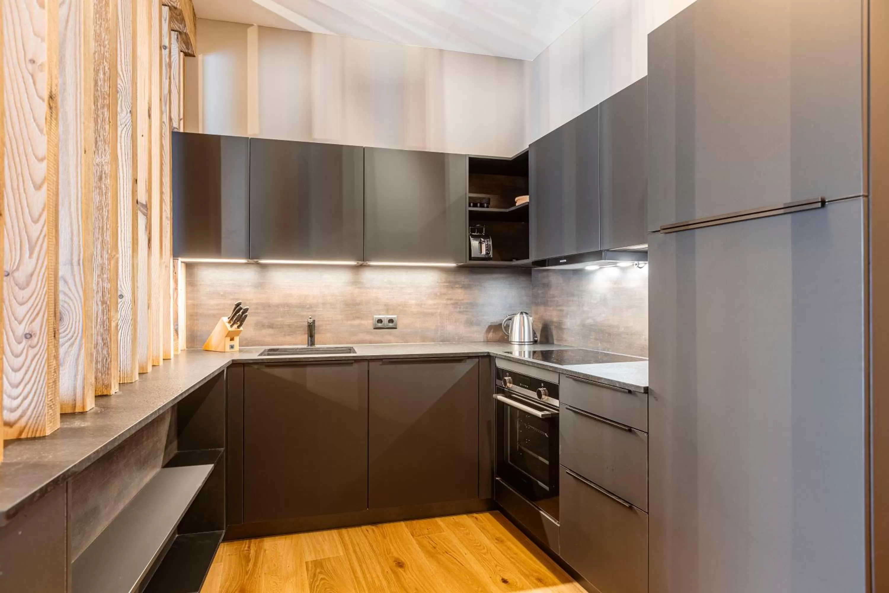 Kitchen or kitchenette in Zillertal Suites Fügen by ALPS RESORTS