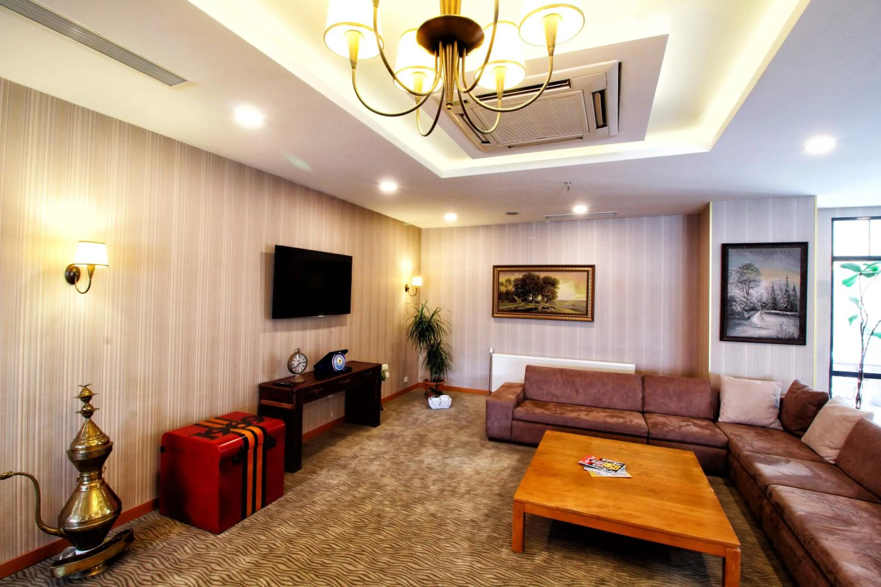 Communal lounge/ TV room in Sarissa Hotel