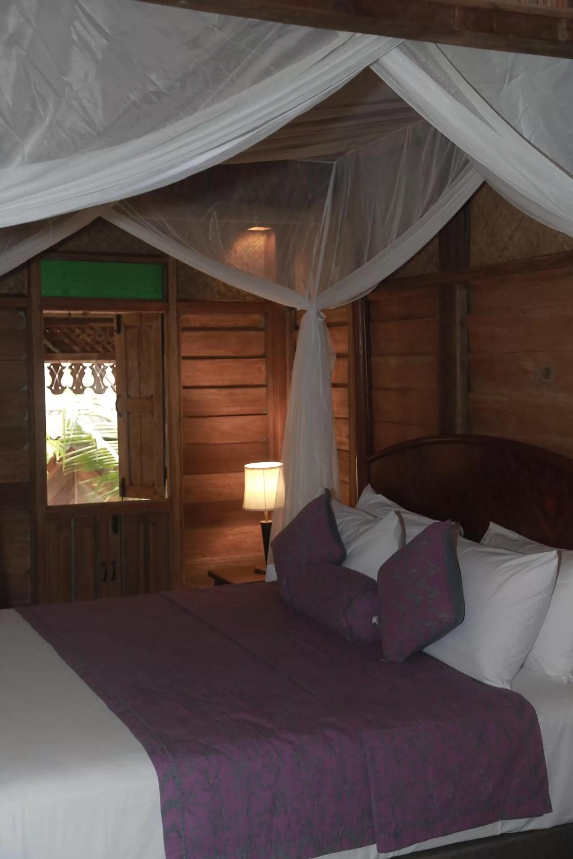 Bed in Kunang Kunang Heritage Villas