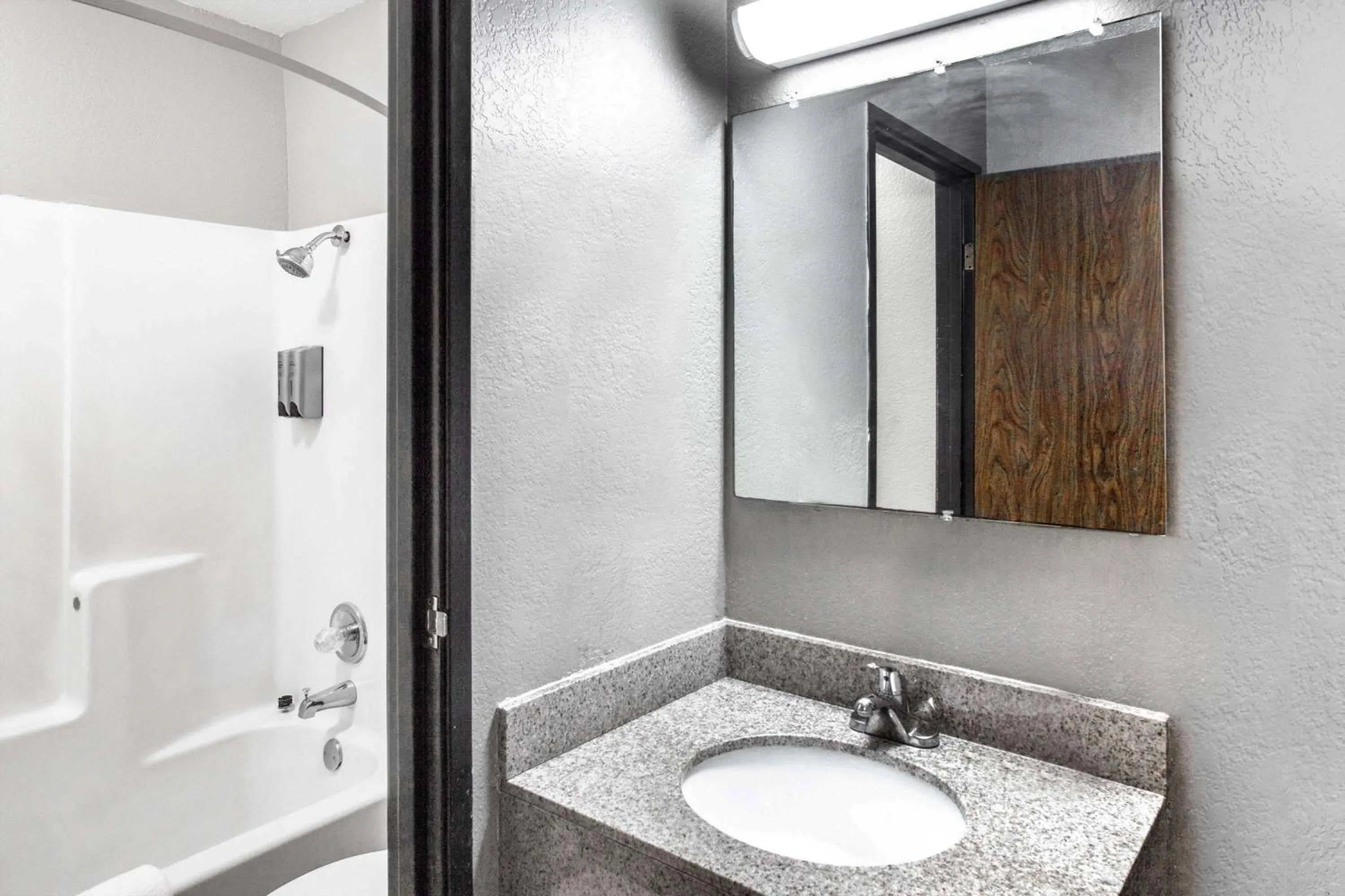 Bathroom in Super 8 by Wyndham Sherman