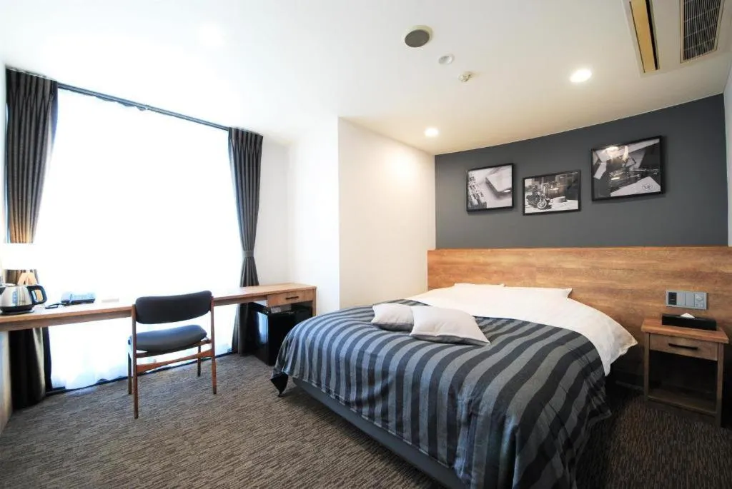 Bed in Hotel cooju Fukui